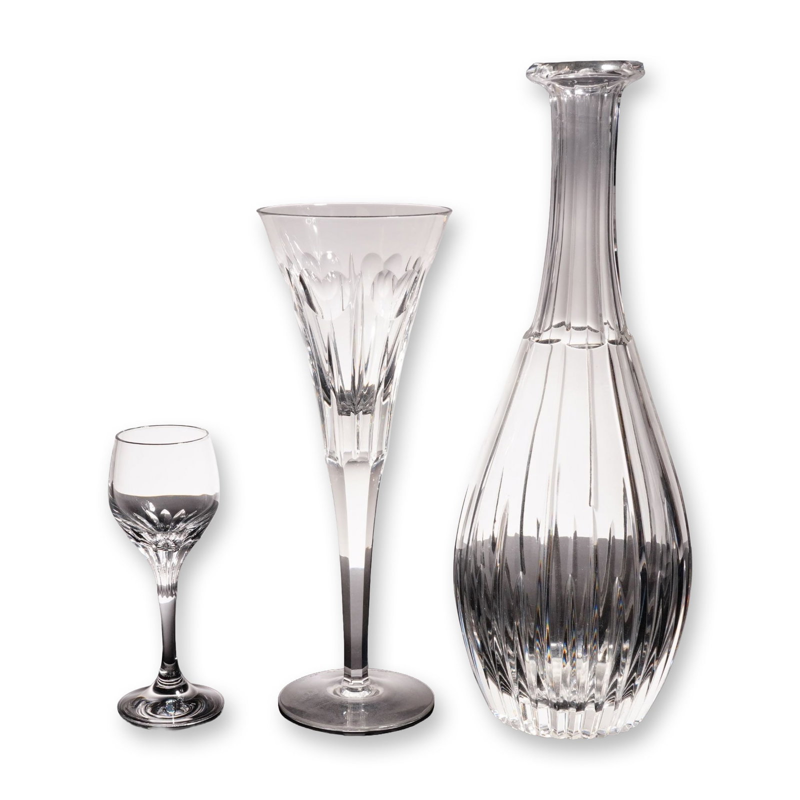 3pc Waterford and Schott Zwiesel Cut Crystal Stemware and Decanter: Collection includes a Waterford Crystal Love champagne flute from the Millennium Series, hand-signed "Fred Curtis 10-29-99," with Waterford mark. Also includes a Schott Zwiesel Revue pattern cordial g