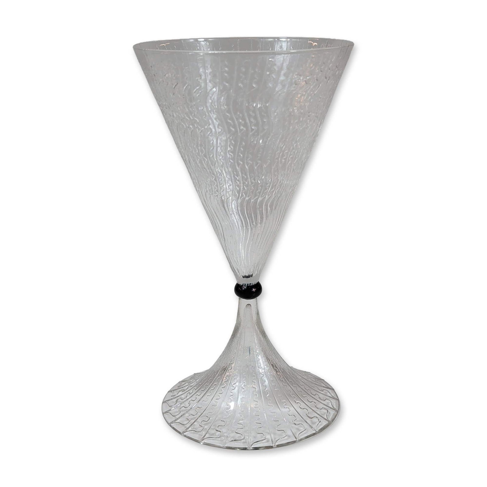 Rene Lalique Vrilles de Vigne Wine Glass: The vessel is decorated with an overall textured pattern consisting of vertical ribs and horizontal undulating lines. The two sections are joined at the waist by an applied opaque black glass spherica