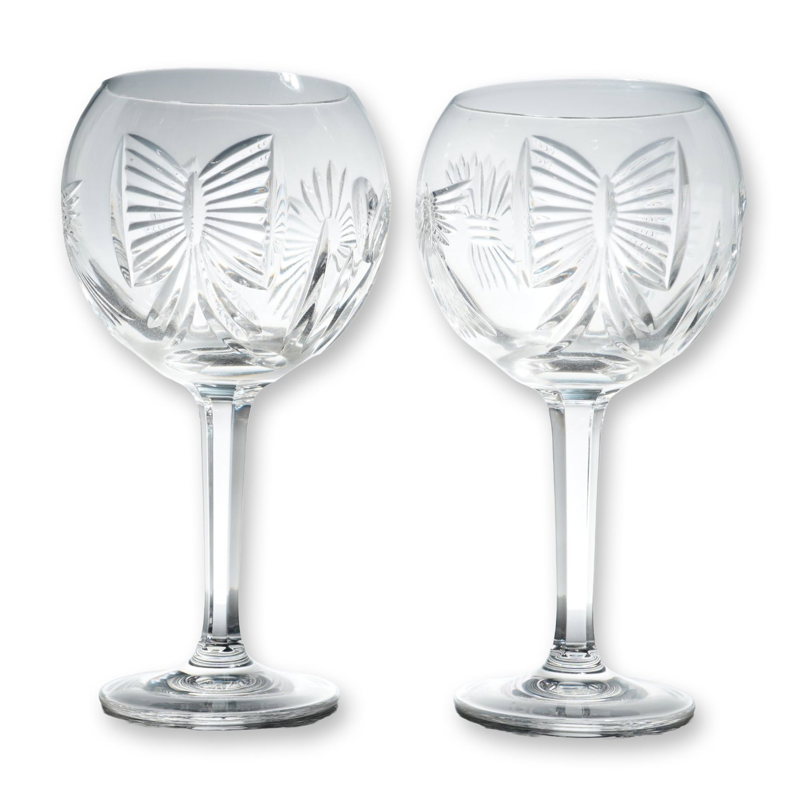 Pair of Waterford Millennium Collection Toasting Goblets, Happiness: Pair of Waterford crystal toasting goblets from the Millennium Collection. These pieces feature the "Happiness" pattern, decorated with hand-cut motifs encircling the bowl, including a winged heart, a