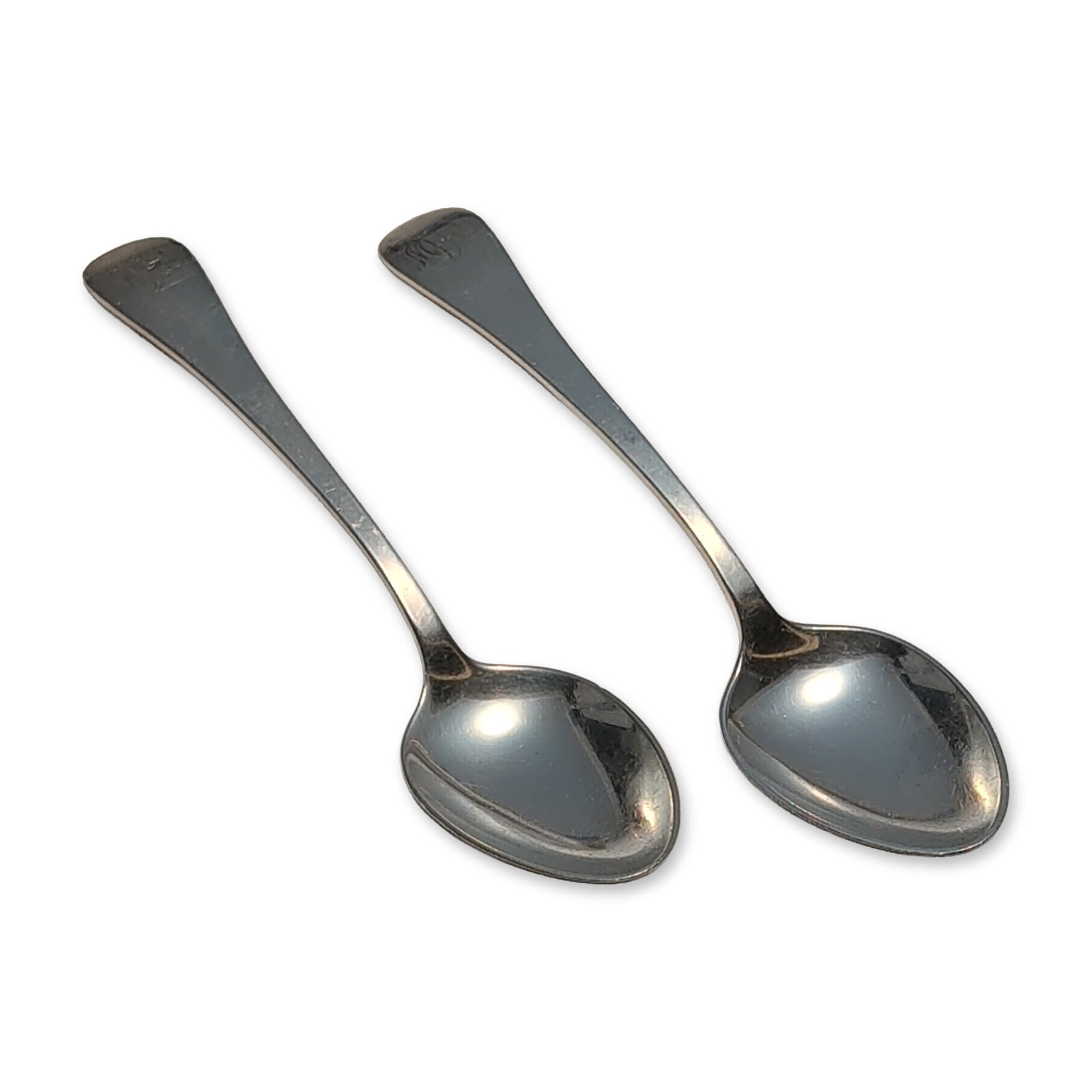 2pc Tuttle Silver Company Sterling Silver Teaspoons, Hannah Hull: A pair of sterling silver teaspoons, each with a plain handle and an engraved stylized monogram at the terminal. The reverse of the handles is stamped STERLING alongside Tuttle Silver Company