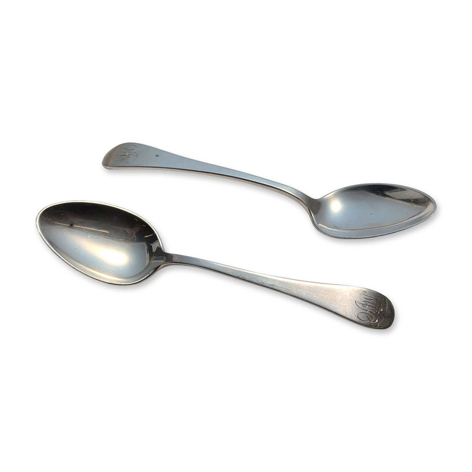 2pc Tuttle Silver Company Sterling Silver Teaspoons, Hannah Hull: Two sterling silver teaspoons with plain handles, each terminating in an engraved stylized monogram. The reverse of the handles is stamped STERLING and bears the Tuttle Silver Company hallmarks.