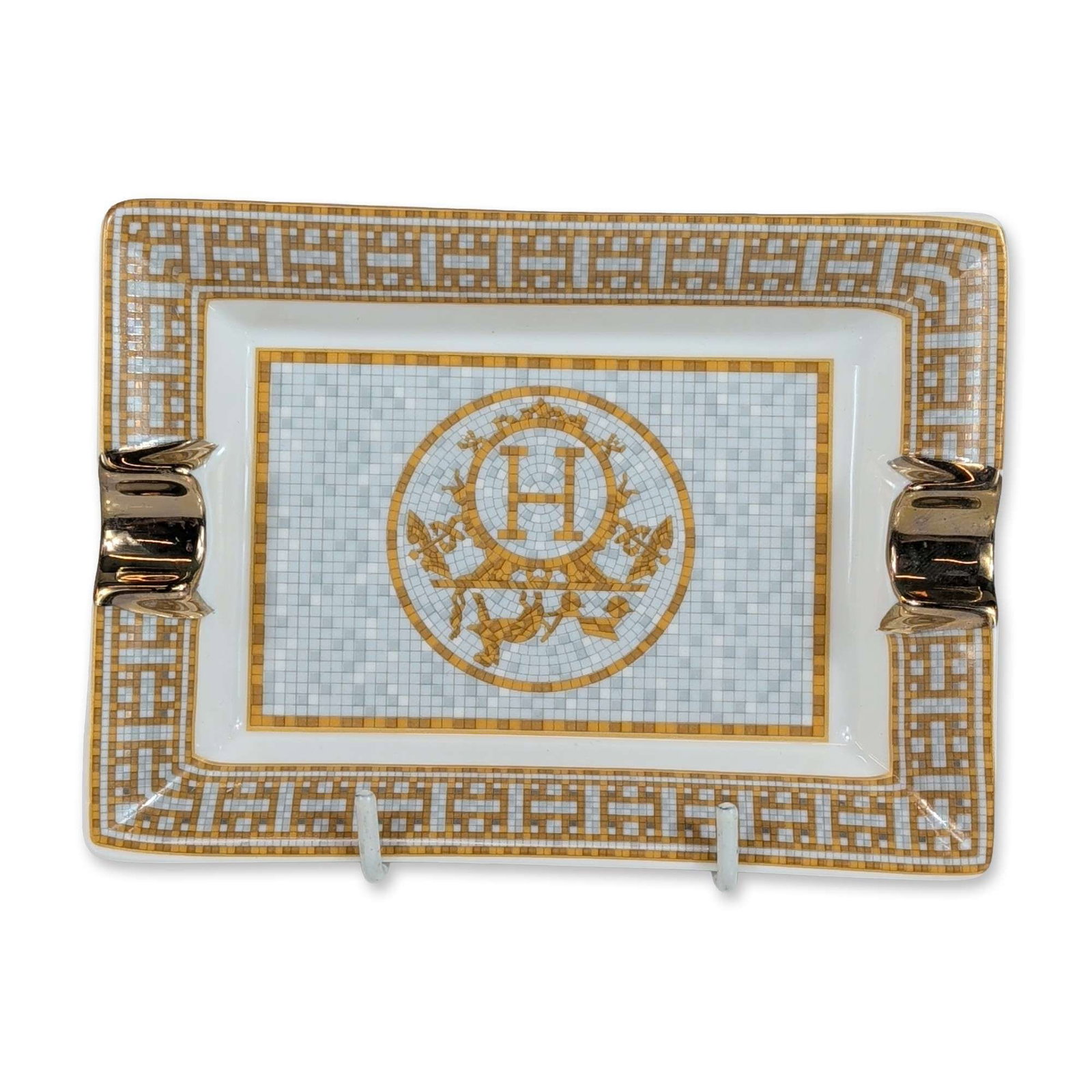 Hermes France Mosaique au 24 Gold Collection Porcelain Ashtray: Hermes rectangular porcelain ashtray in the Mosaique au 24 gold pattern collection, featuring a grey and gold mosaic design. The central well displays a medallion with an H monogram and horse-and-carr