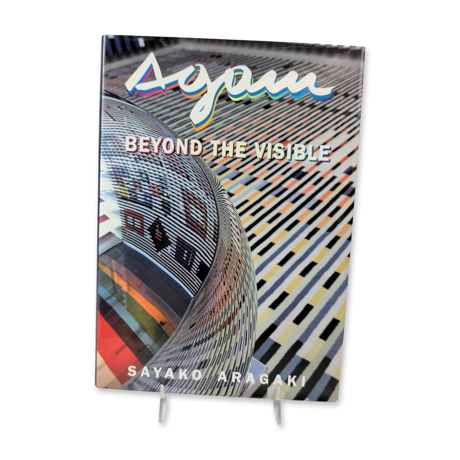 Sayako Aragaki Agam: Beyond the Visible, Hardcover Art Book: Sayako Aragaki. Hardcover art book titled Agam: Beyond the Visible, 2007 revised edition published by Gefen Publishing House. Features color and monochrome illustrations documenting the kinetic works 