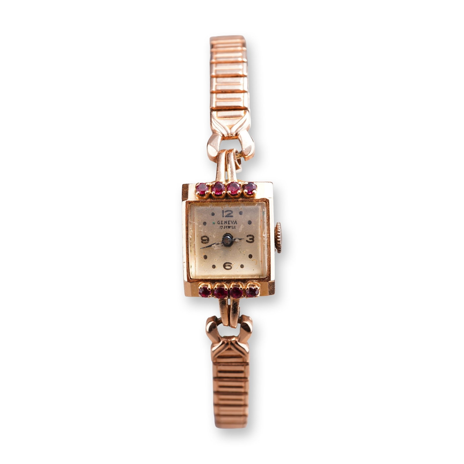 Geneva Vintage 14K Rose Gold and Ruby-Set Cocktail Watch: Geneva. Vintage ladies cocktail watch in rose gold, featuring a square case set with eight round faceted rubies, four flanking each side of the dial. Manual wind 17-jewel movement. Beige dial with Ara