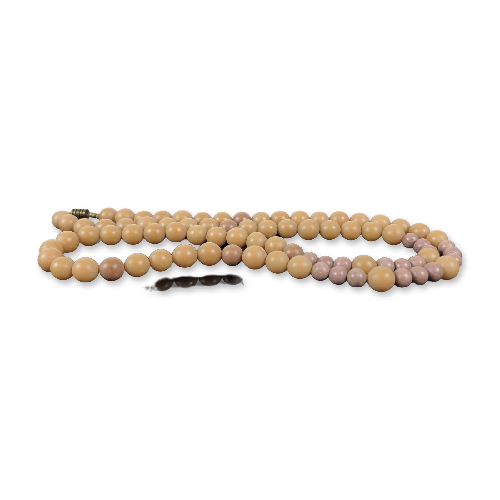 Vintage Graduated Stone and Composition Beaded Necklace: Vintage single-strand beaded necklace featuring graduated matte tan spherical beads, possibly composed of a molded material like bakelite, alternating with smaller mottled pink and lavender stone bead