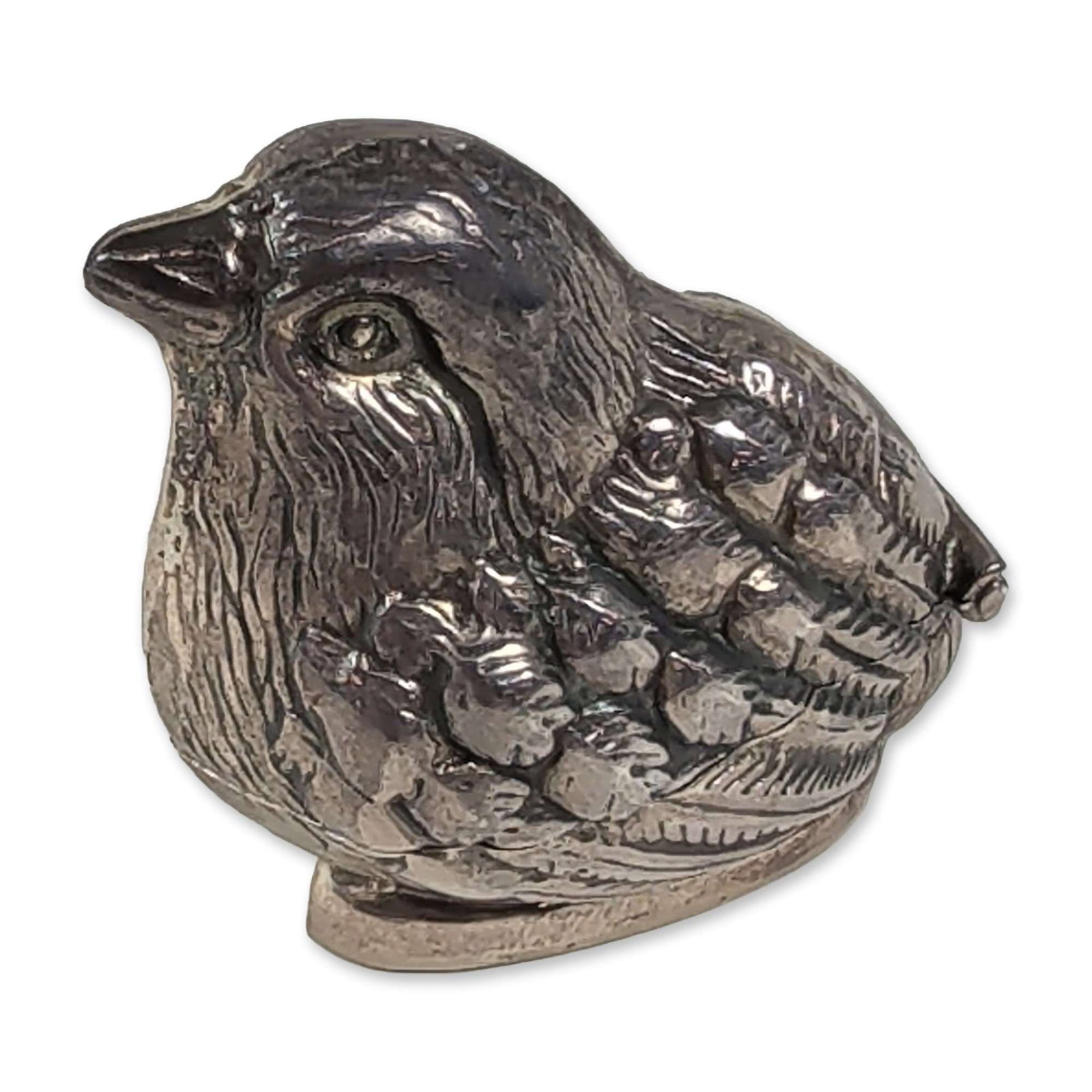 Late 20th Century Sterling Silver Quail Hinged Box: Late 20th century. Hinged pin box or needle case in sterling silver, featuring a bird in the form of a quail with detailed cast plumage. The container opens at a hinge located at the neck to reveal a 