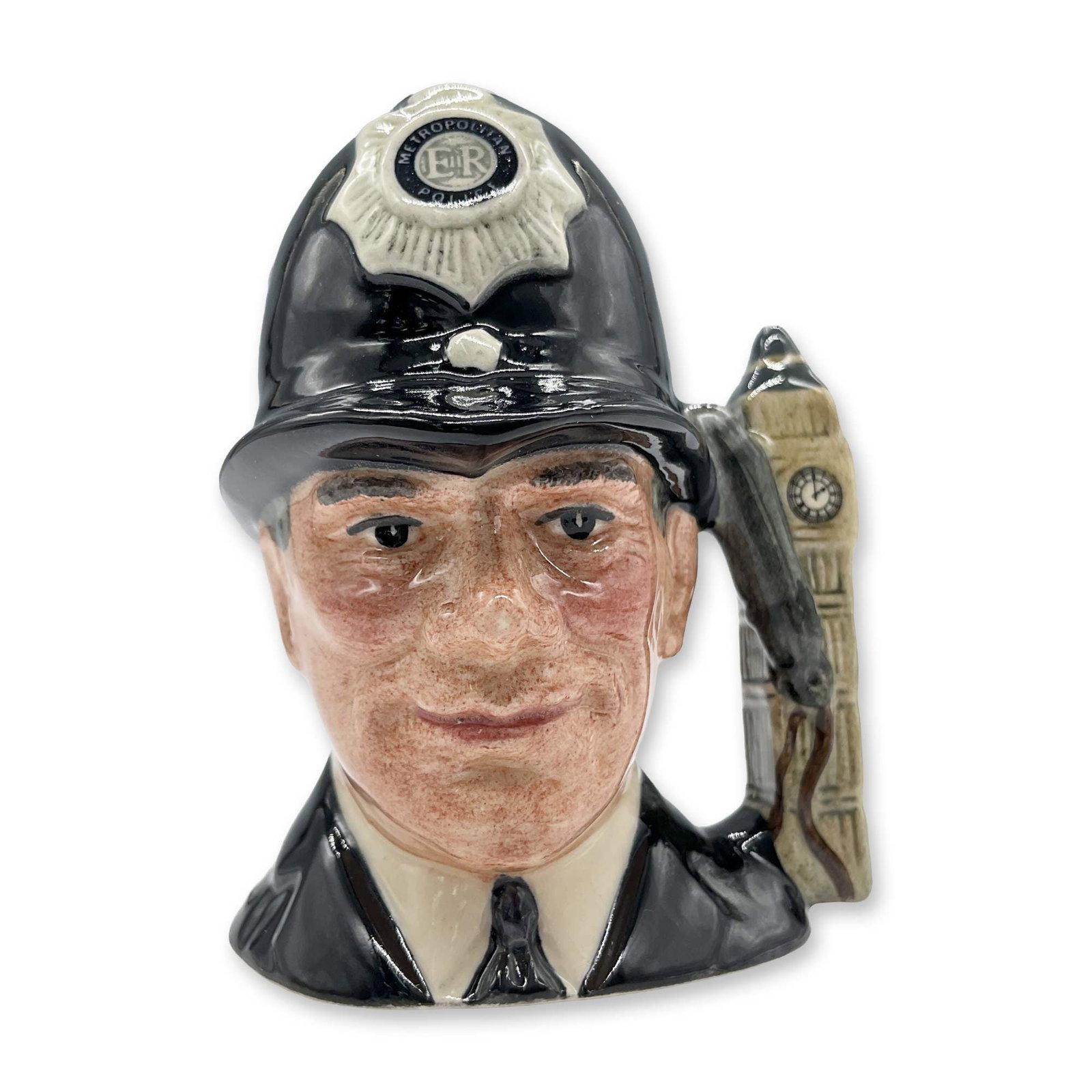 London Bobby D6763 (Non Embossed) Mini Doulton Character Jug: Variation Two, black uniform; white and black helmet badge; grey whistle. Royal Doulton backstamp. Artist: Stanley J. Taylor Dimensions: 2.25"L x 2"W x 3"H Date or Era: 1987 - 1991 Manufacturer or Bra