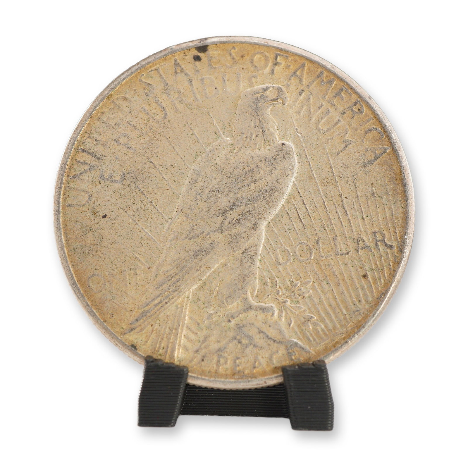 1923-S US One Dollar Peace Silver Dollar Coin, Circulated: This 1923 Peace silver dollar was produced at the San Francisco Mint, as indicated by the absence of a mint mark on the reverse. The coin is struck in 90% silver and 10% copper. The obverse features t