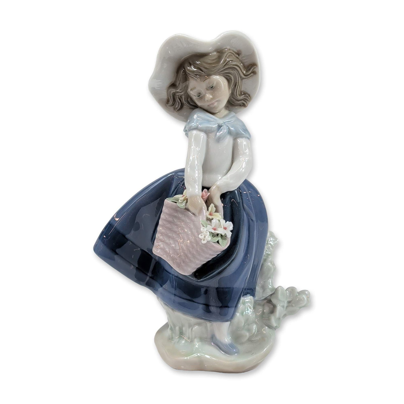Lladro Porcelain Figurine Pretty Pickings: Lladro (Spain) glossy porcelain figurine titled Pretty Pickings, model number 5222, designed by Jose Puche. The figurine depicts a young girl in a long blue skirt and white blouse with a blue ribbon, 