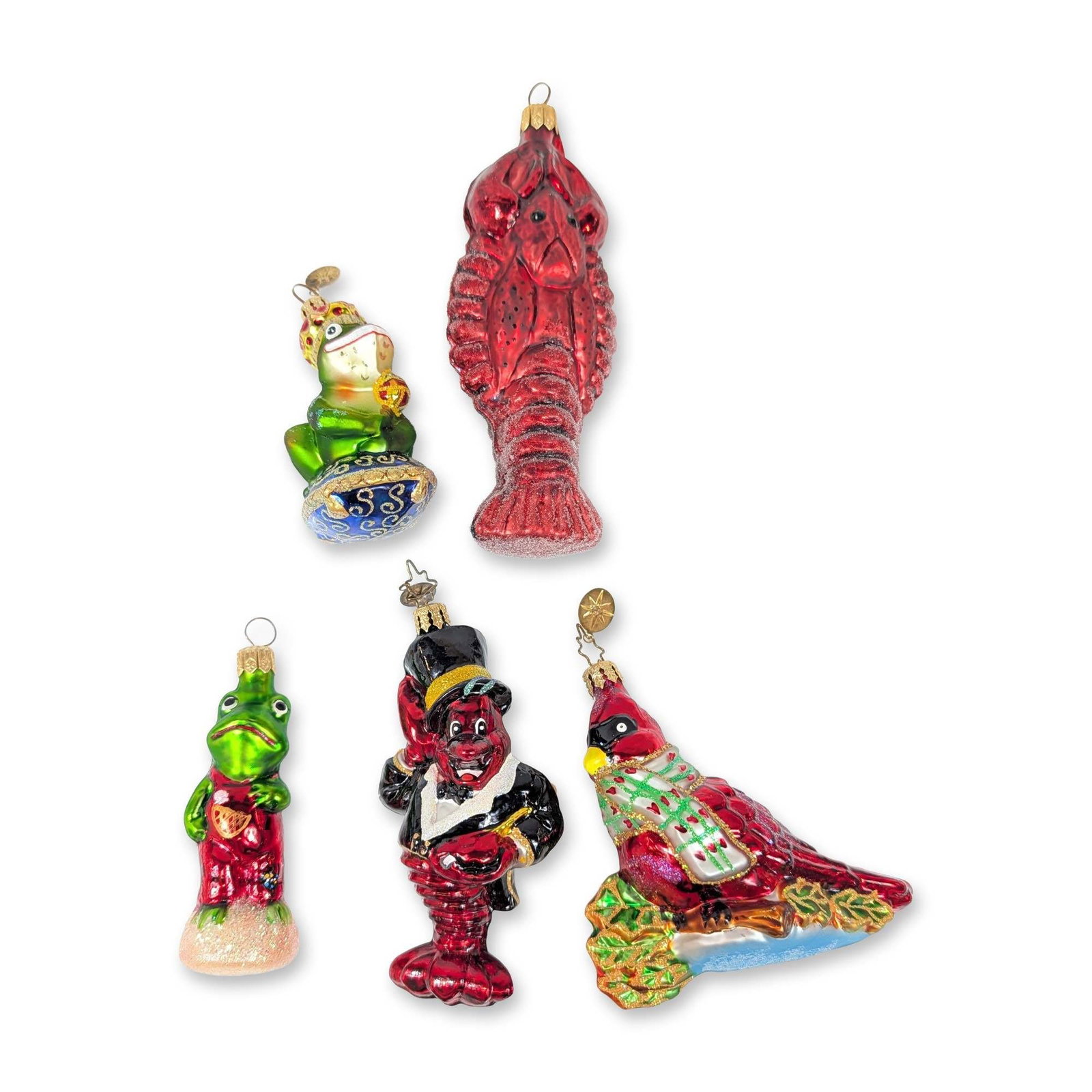 Collection of Five Christopher Radko Glass Christmas Ornaments: Christopher Radko collection of five hand-painted and mouth-blown glass Christmas ornaments, including the Froggy Child, Never Been Kissed frog prince, a cardinal wearing a plaid scarf, a red lobster