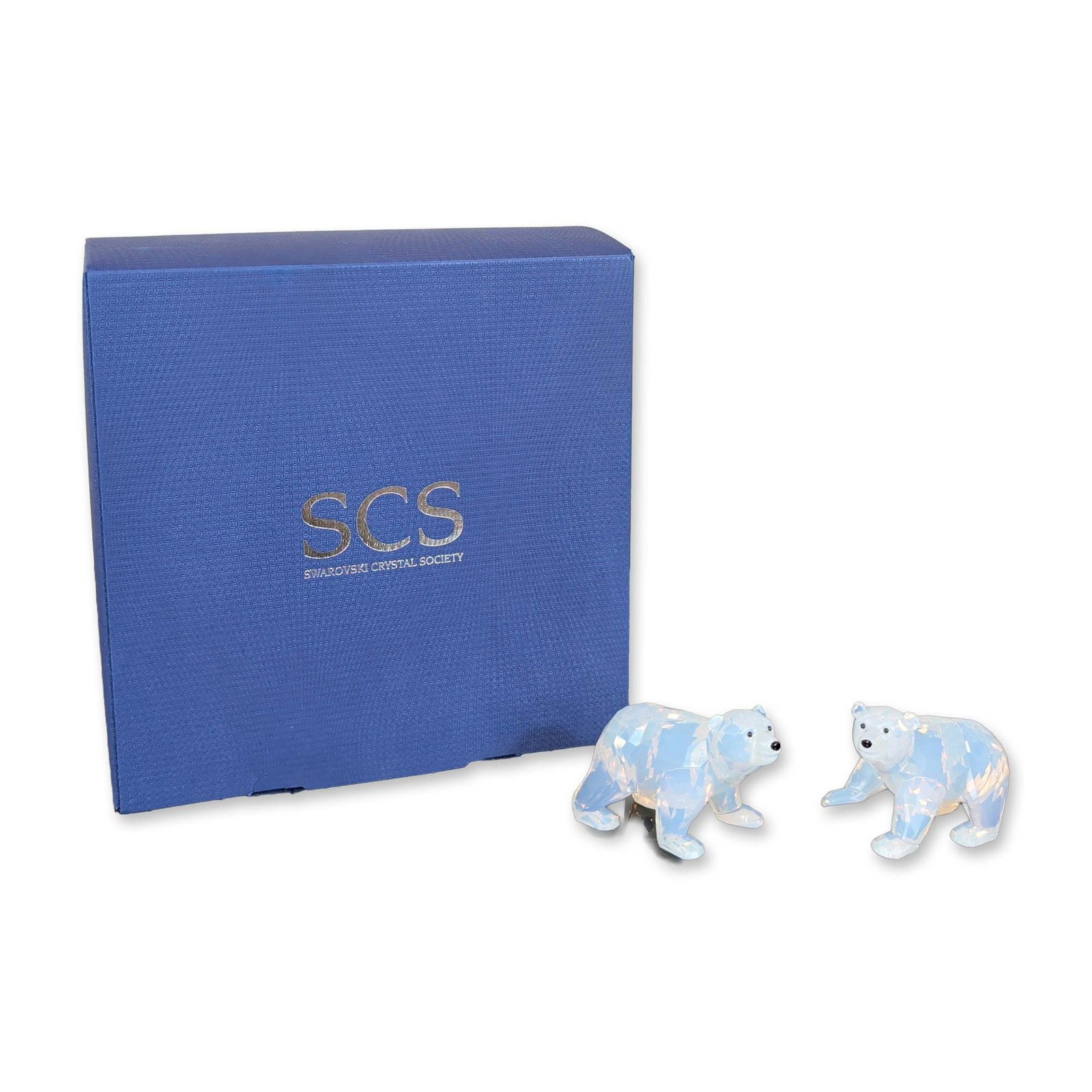Swarovski SCS White Opal Crystal Polar Bear Cubs: Swarovski Crystal Society (SCS) polar bear cubs from the 2006 Arctic collection. The set includes two faceted figurines crafted in White Opal crystal with jet crystal eyes and noses. Each base