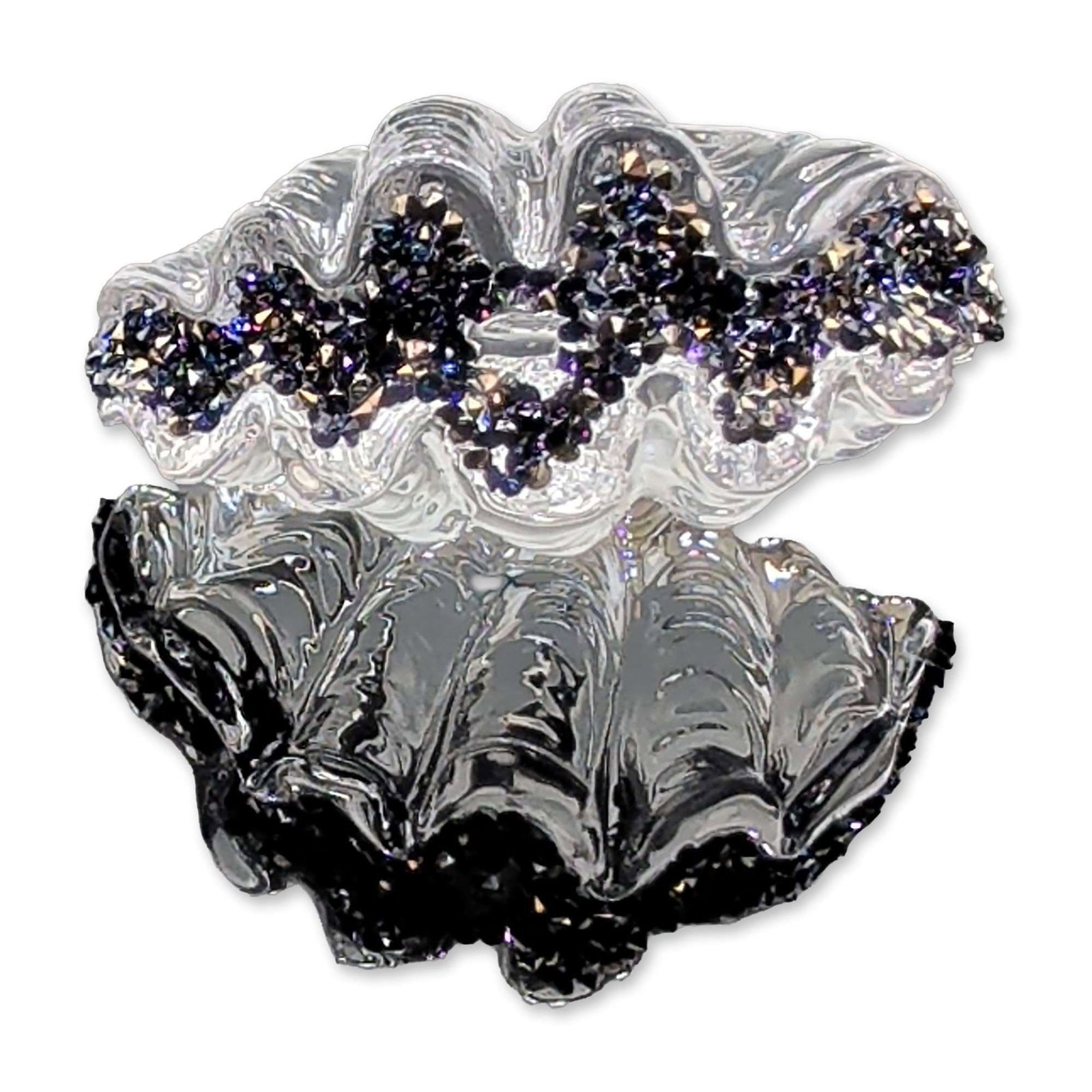 Swarovski 2025 Loyalty Crystal Shell Gift: Swarovski crystal clam shell figurine featuring a clear fluted body with ruffled edges. One margin is detailed with a dense encrustation of dark, iridescent faceted crystals. The piece is accompanied 