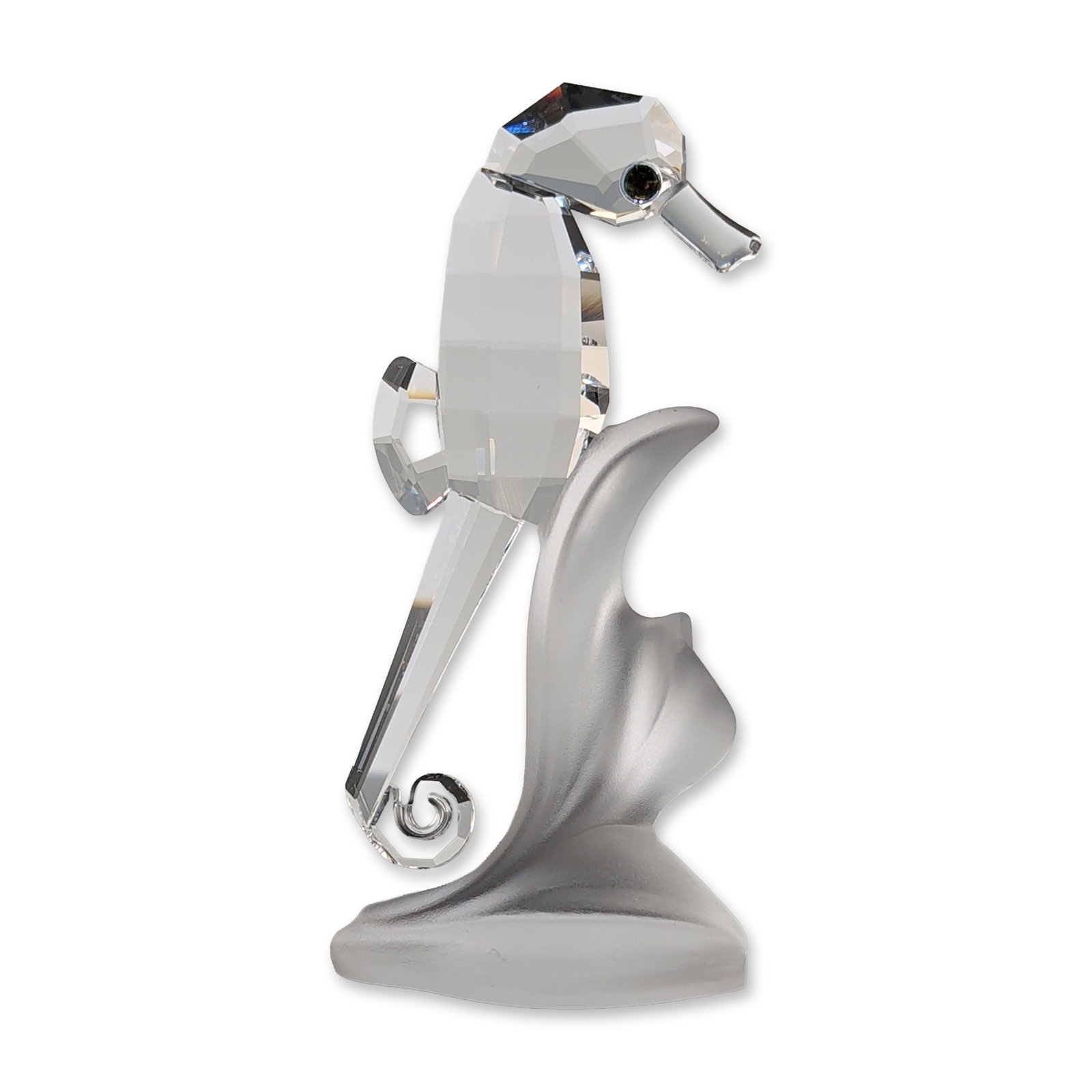 Swarovski Silver Crystal Seahorse Figurine: Swarovski faceted lead crystal figurine of a seahorse from the Silver Crystal collection, part of the South Seas series. The piece features a clear faceted crystal body with a dark crystal eye and a c
