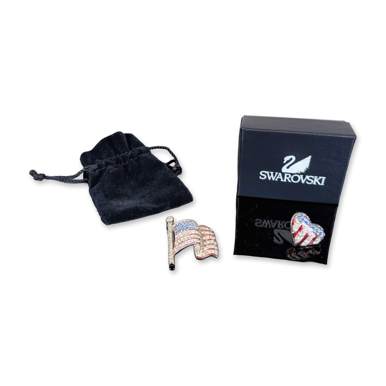 2pc Swarovski Patriotic Crystal Pins: Swarovski pair of patriotic brooches in silver-tone metal, featuring red, blue, and clear pave-set crystals. Includes The Brave Heart Pin, a heart-shaped American flag tribute created following the ev