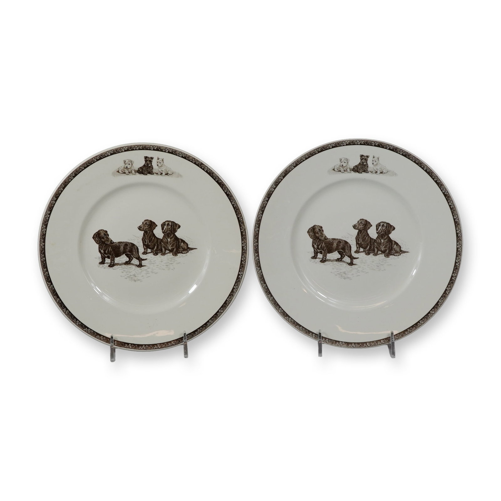 2pc Wedgwood Non-Sporting Terrier and Working Dog Plates: This pair of circular earthenware plates by Wedgwood is part of the Non-Sporting, Terrier and Working Dog series, featuring designs based on original etchings by artist Marguerite Kirmse. Each plate i