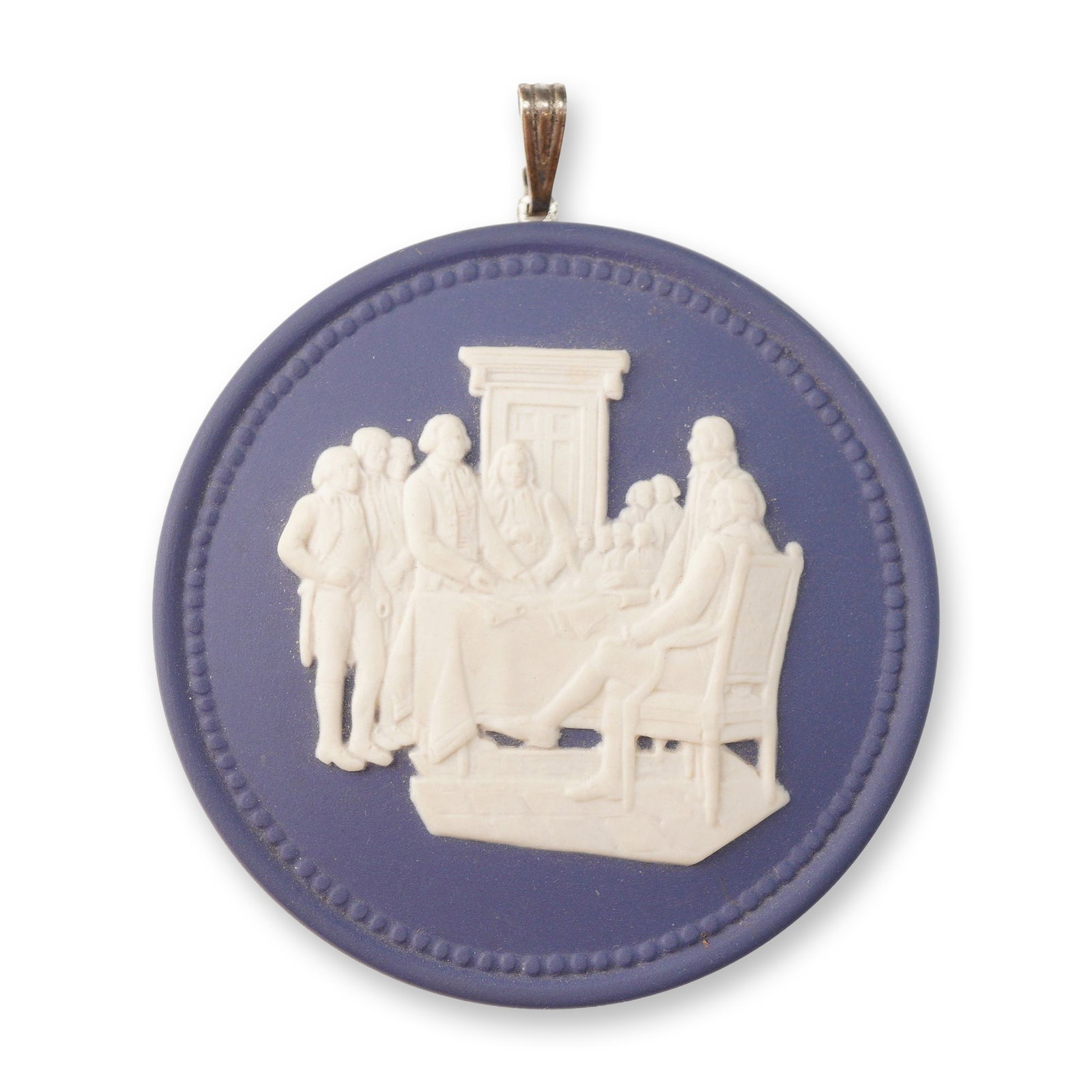 Wedgwood Jasperware Medallion Pendant Depicting the Signing of the Declaration of Independence: This is a circular Wedgwood jasperware medallion pendant featuring a matte blue ground with white bas-relief decoration. The central scene depicts the signing of the Declaration of Independence, showi