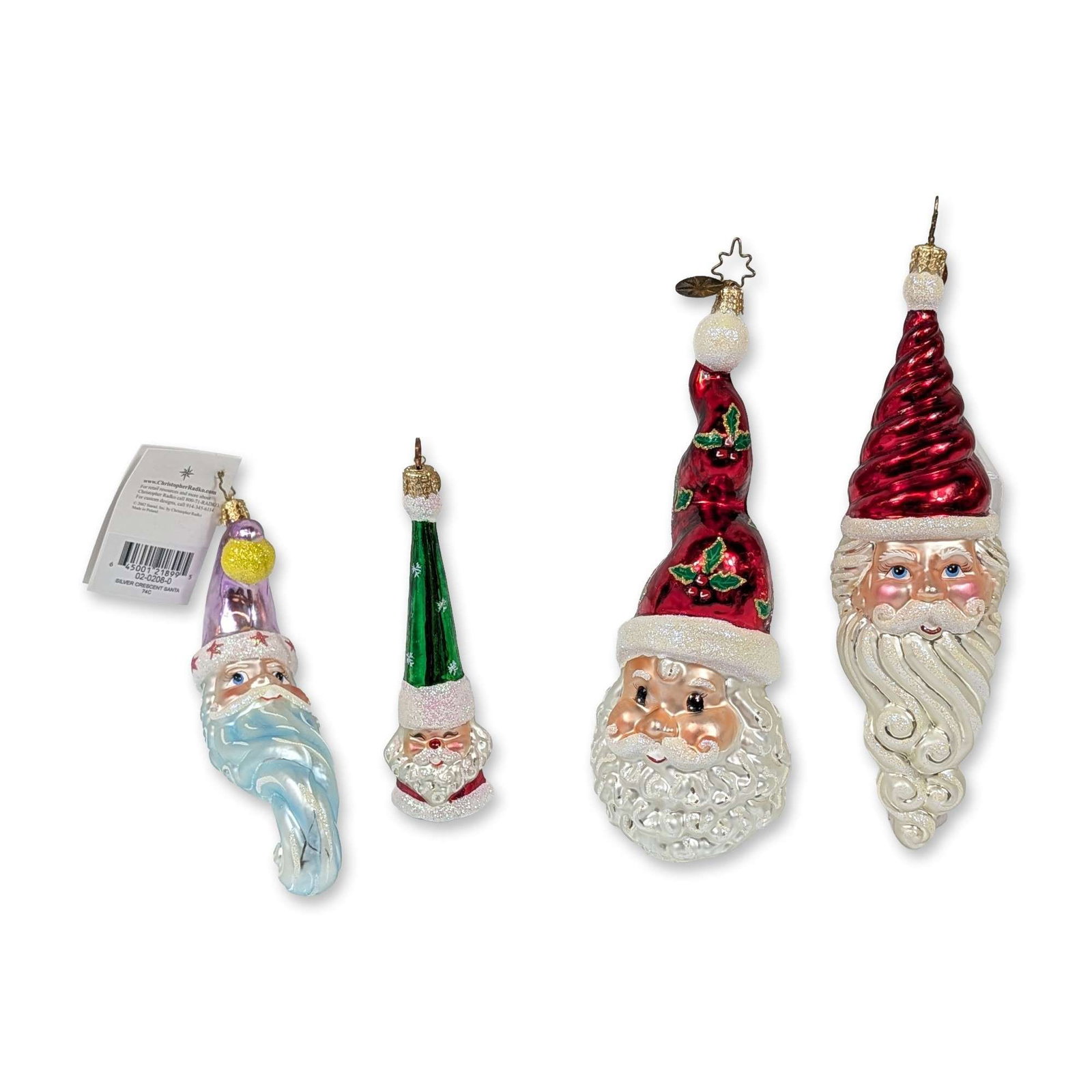 Collection of Four Christopher Radko Glass Santa Ornaments: Collection of hand-blown glass Christmas ornaments featuring various Santa Claus motifs. The assortment includes a Silver Crescent Santa in iridescent light blue with a purple hat, a Peppermint Twist 