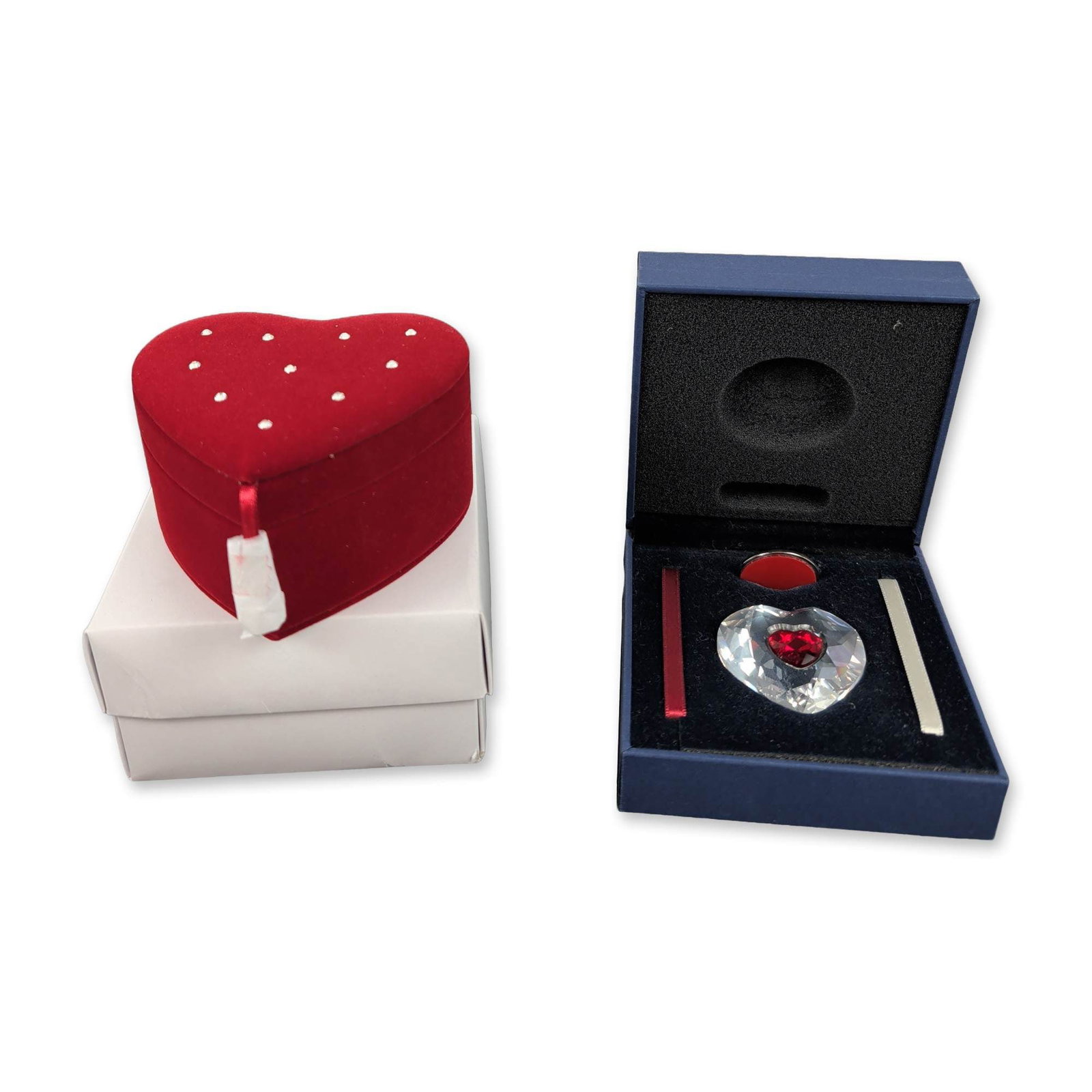 2pc Swarovski 2004 Annual Edition Crystal Heart Ornament and Jewelry Box: Exquisite two-piece Swarovski Heart set showcasing a stunning clear and red faceted lead crystal ornament with a vibrant inset red heart at its center. The piece is adorned with a silver-tone metal ci