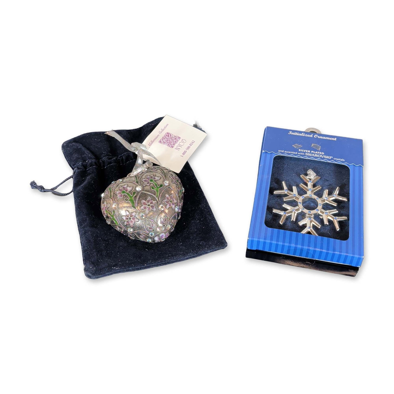 2pc Swarovski Crystal with Harvey Lewis Designs and NYCO Ornaments: Two holiday ornaments featuring Swarovski crystal accents. The first is a silver-plated snowflake ornament, featuring clear and blue crystals and a central cutout. The second is a heart-shaped metal o