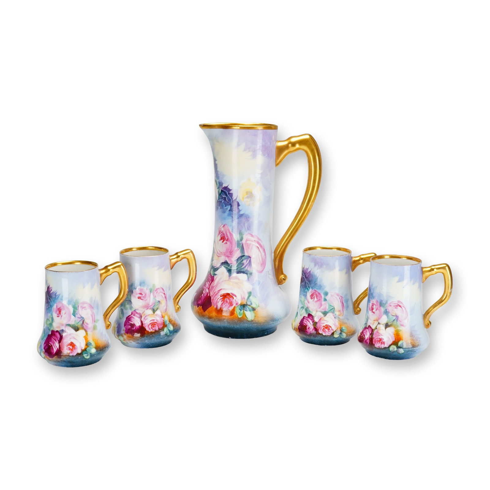 5pc B&H Limoges France Hand Painted Floral Pitcher and Cup Set: This is a five-piece porcelain beverage set produced by the firm of Blakeman and Henderson in Limoges, France. The collection includes one tall tankard pitcher with a flared base and four matching