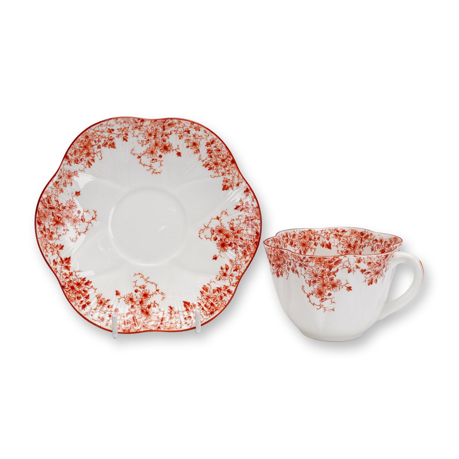 Shelley Cup and Saucer in Dainty Shape with Maroon Floral Pattern: This lot consists of two pieces of Shelley fine bone china, including a teacup and a matching saucer. Both items are in the Dainty shape, which is characterized by lobed, scalloped edges that resemble