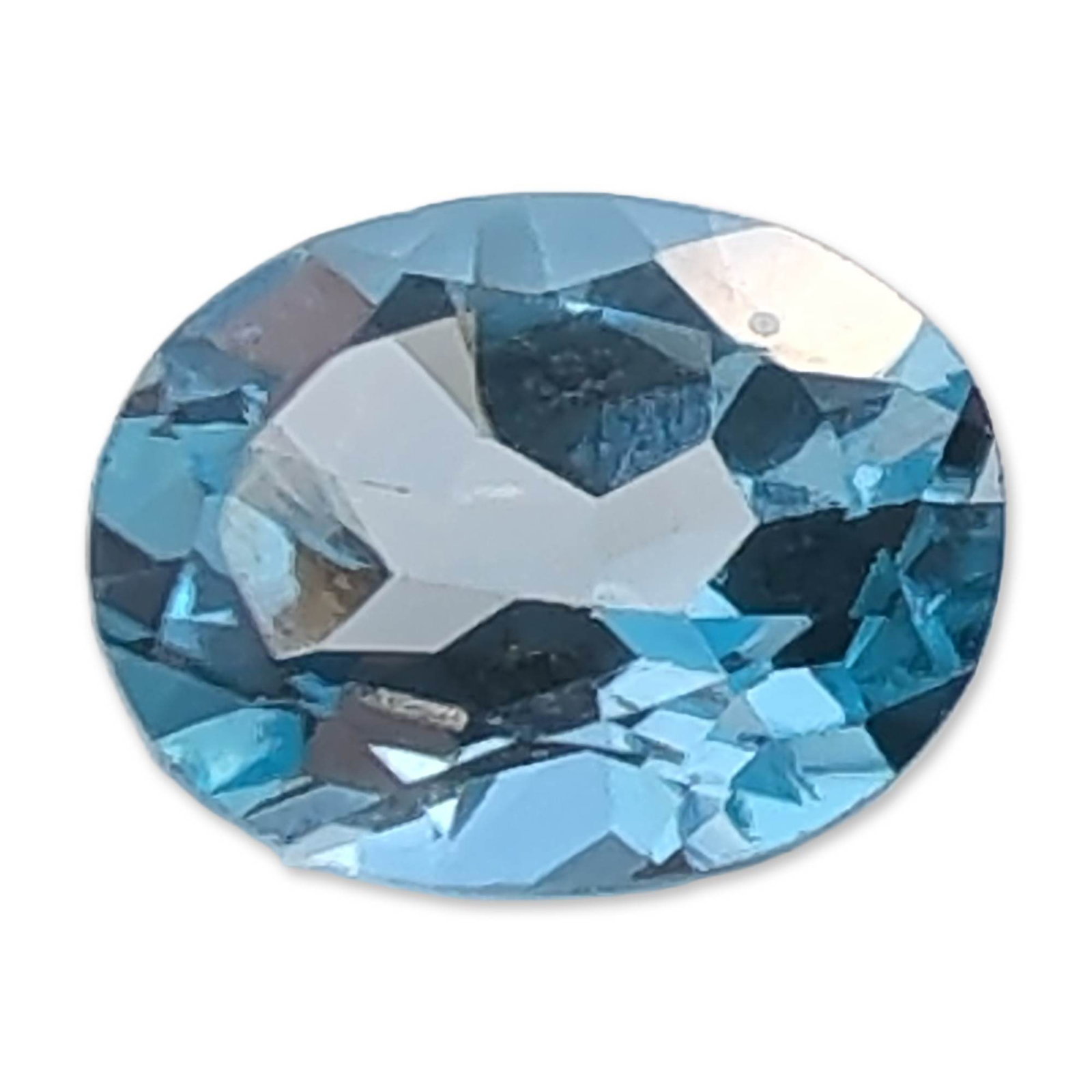 Oval Light Blue Topaz Gemstone: Loose oval faceted Topaz gemstone. Transparent light blue color exhibiting a standard brilliant-style crown and deep pavilion. No internal inclusions are visible under standard magnification. Weight: