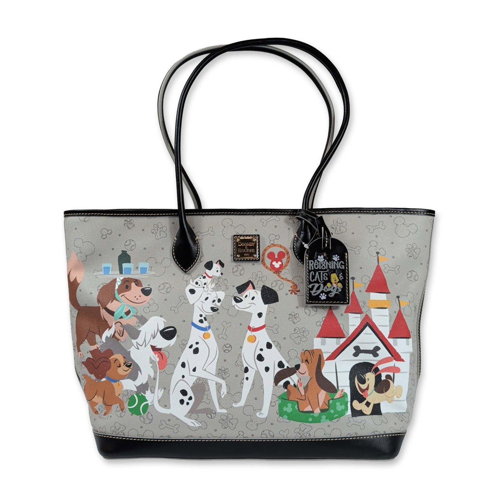 Disney x Dooney and Bourke Reigning Dogs Tote Bag: Disney and Dooney and Bourke collaborative tote bag from the Reigning Cats and Dogs collection. Crafted in coated cotton canvas with black leather trim and dual shoulder straps. The light gray exterio