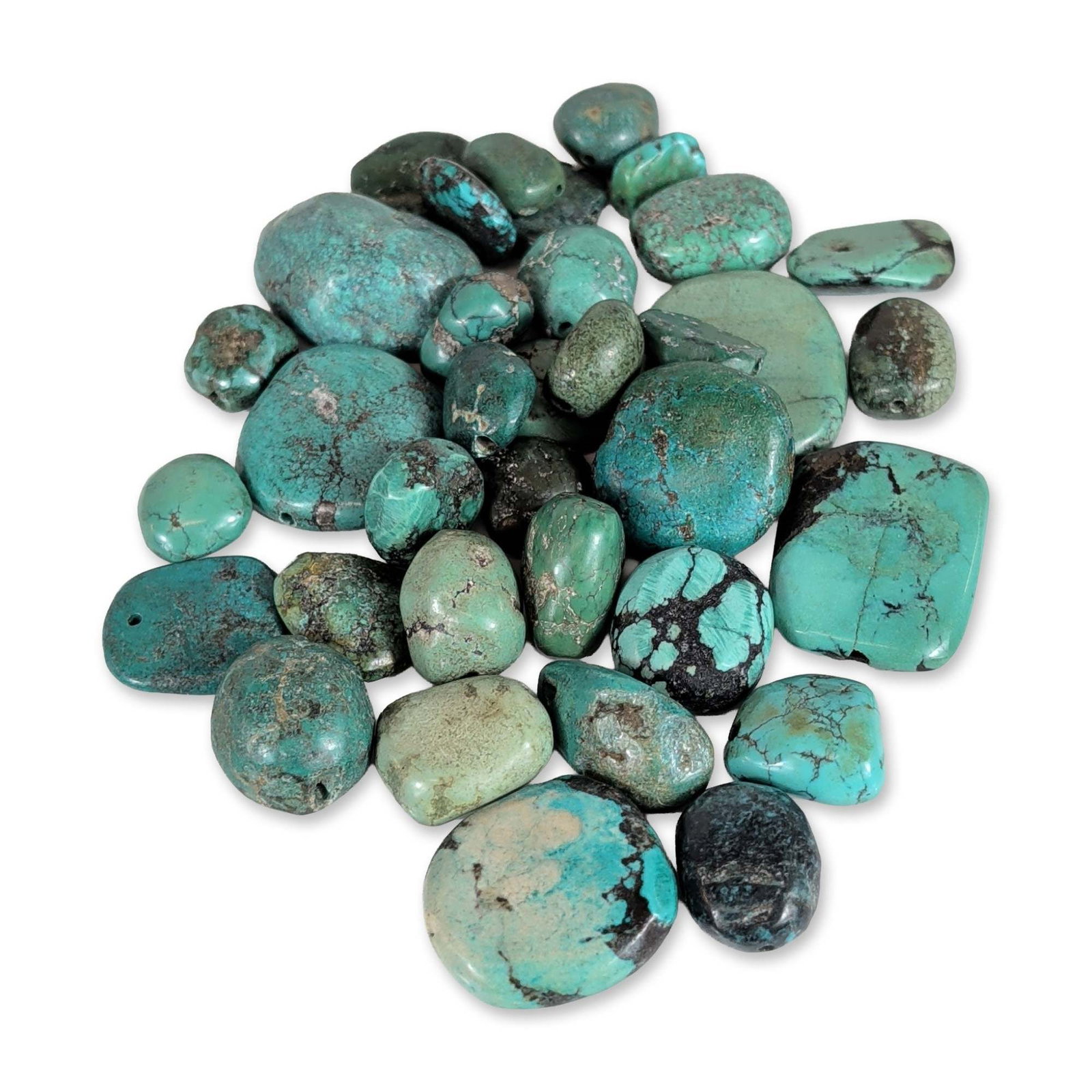 Collection of Approximately 40 Turquoise Beads and Nuggets: An assortment of approximately 40 loose gemstones that appear to be turquoise, presented as tumbled nuggets and focal stones. The collection displays a wide color spectrum, including robin egg blue,