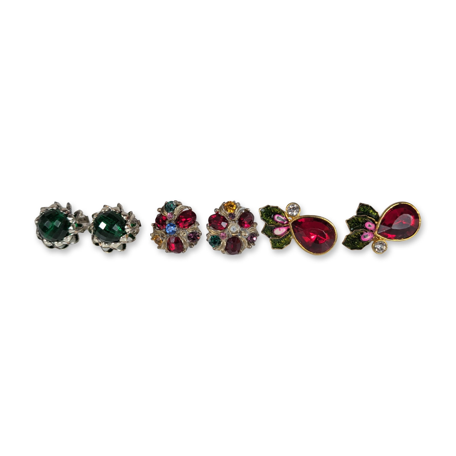 3 pairs of Vintage Jewelry Earrings: An assortment of three pairs of vintage costume jewelry earrings, including holiday-themed and mid-century styles. The group includes a pair of Avon gold-tone clip-on earrings featuring a pear-shaped 
