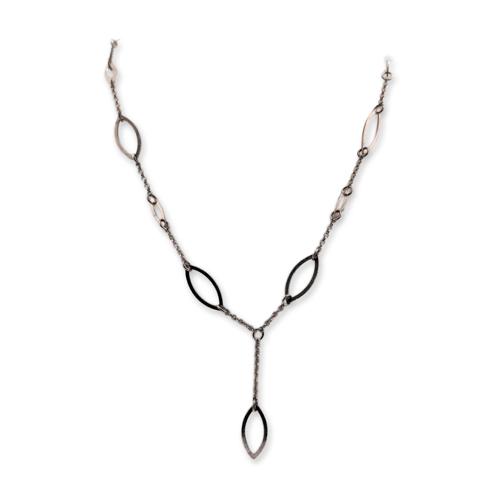 Sterling Silver Y-Style Open Marquise Station Necklace: Sterling silver Y-style station necklace featuring multiple open marquise-shaped stations of varying sizes. The decorative elements are connected by sections of fine cable chain leading to a central j