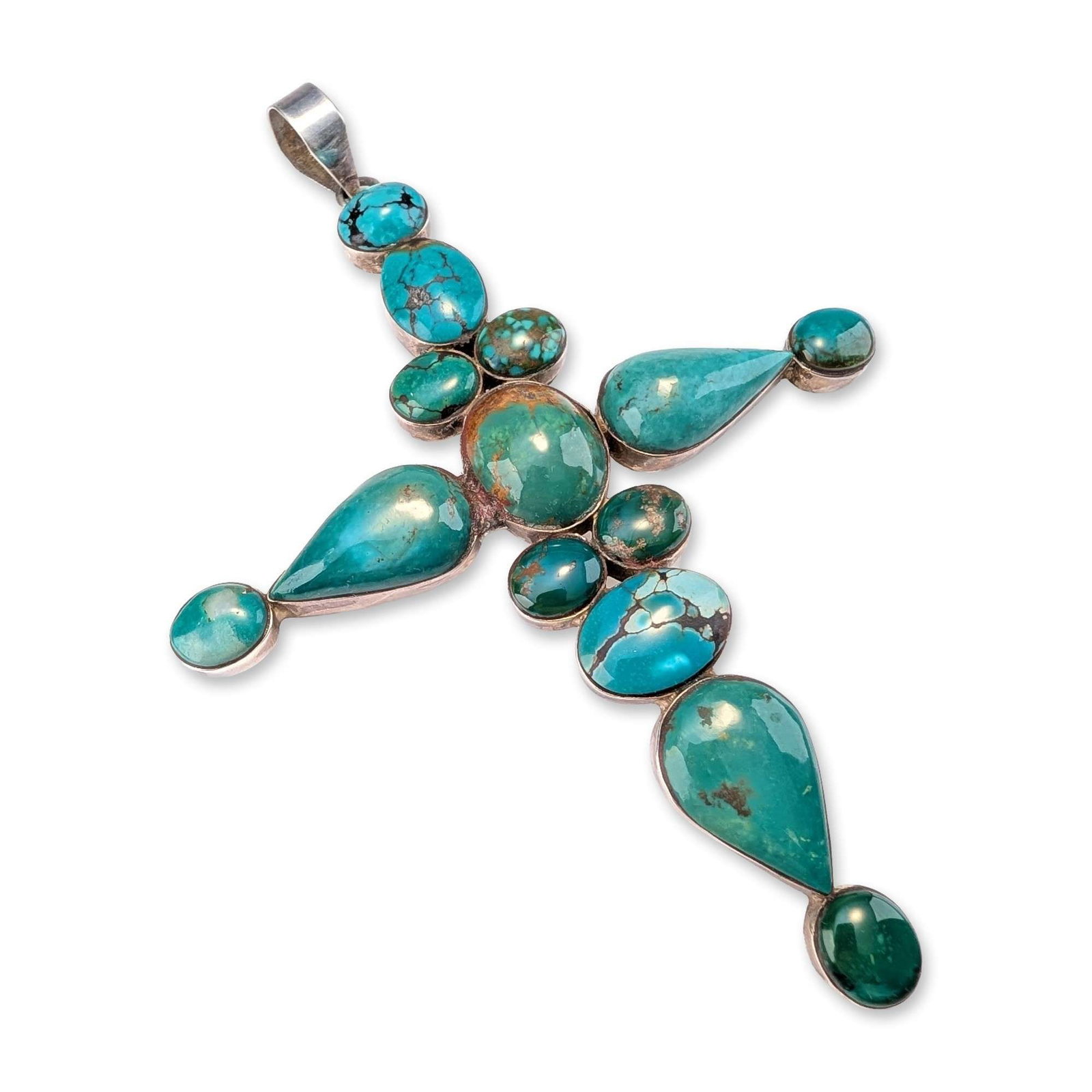 Henry Mariano Sterling Silver Turquoise Cross: Henry Mariano Southwestern cross pendant in sterling silver, featuring bezel-set turquoise cabochons. The design is centered by an oval stone surrounded by four small rounds, with four arms composed o