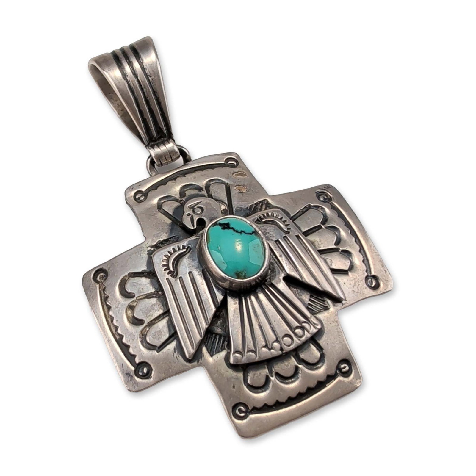 Emer Thompson Navajo Sterling Silver Turquoise Thunderbird Pendant: Navajo sterling silver pendant by silversmith Emer Thompson, featuring a Thunderbird motif centered on an equal-armed cross. The design incorporates a centrally set oval turquoise cabochon with a dark