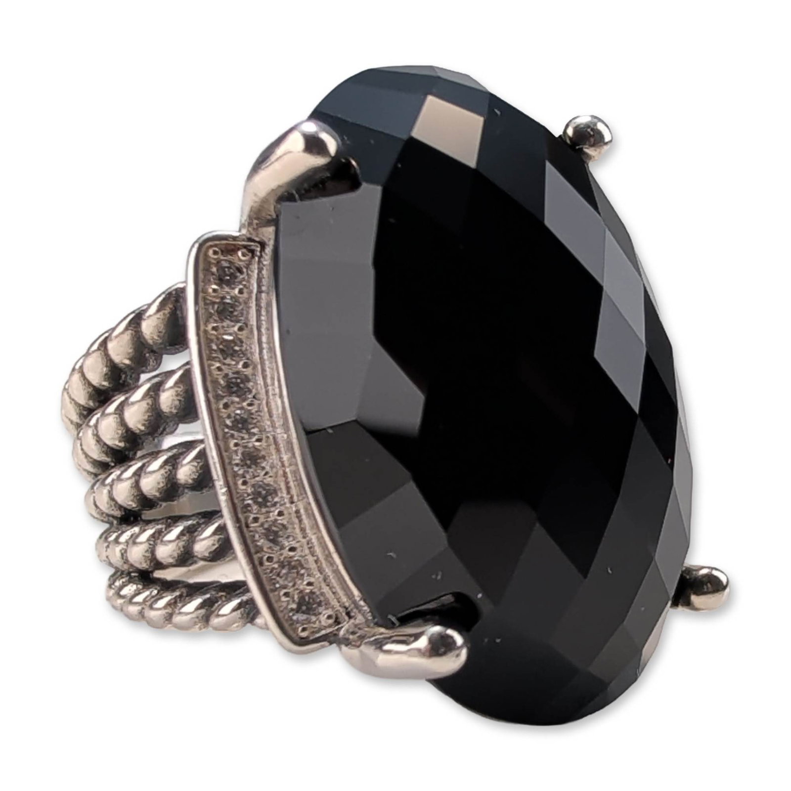 David Yurman Sterling Silver Wheaton Onyx Diamond Ring: David Yurman Wheaton ring in .925 sterling silver, featuring a central faceted oval black onyx held by four prongs. The setting includes a horizontal curved bar pave-set with round brilliant-cut diamo