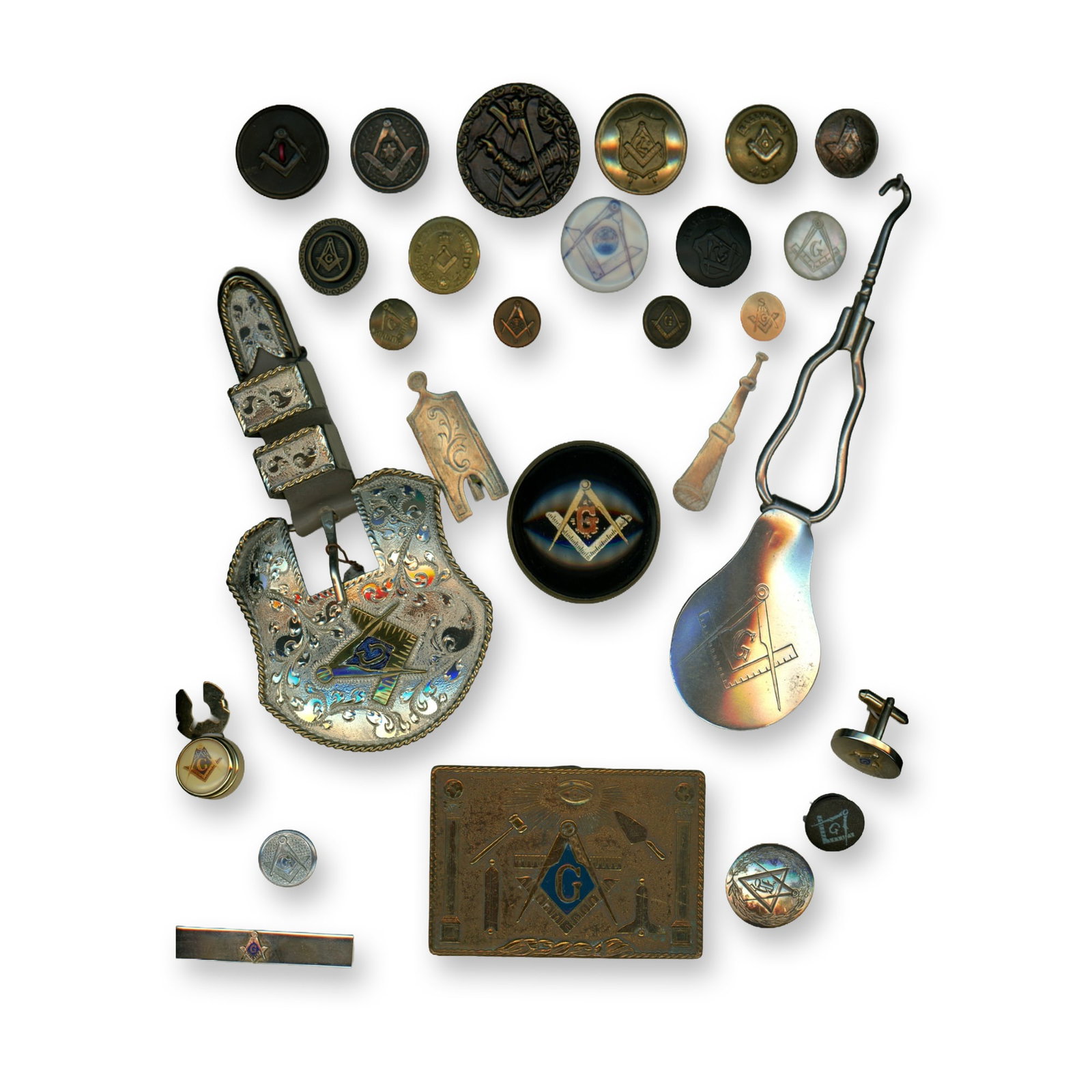 A CARD OF ASSORTED MATERIAL BUTTONS AND SUNDRIES: 14 S/M/L buttons, 2 buckles 1 bridle rosette, 3 Cuffs and more. This is a card of buttons and other items all featuring the Masonic emblem. There are several buttons, a fantastic brass and enamel buck