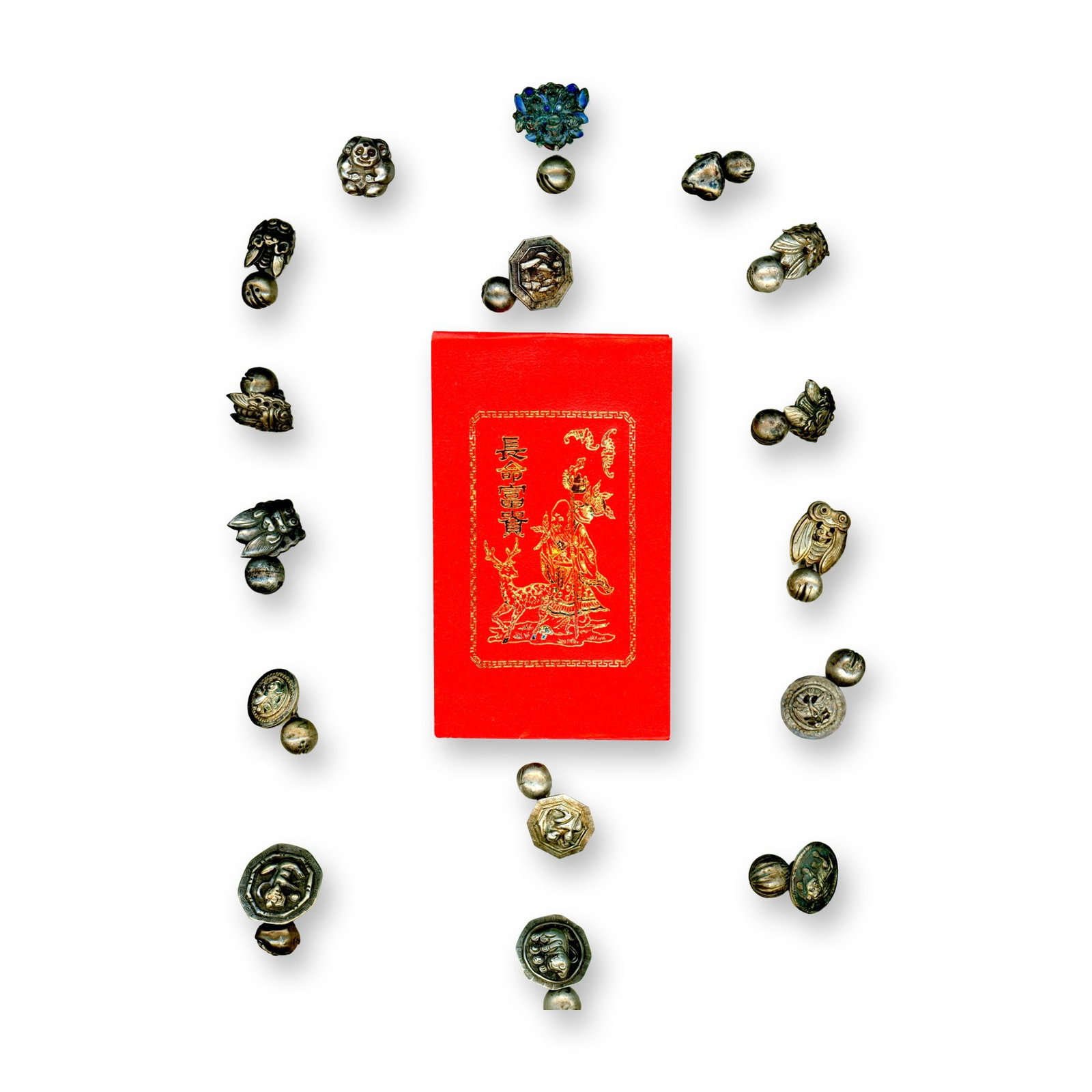A CARD OF DIVISION ONE CHINESE METAL BUTTONS: 16 Silver Toggle button examples from the 19th century. This is a card of early Chinese silver toggle buttons of two piece construction. Some pictorials and perhaps even an enamel example may be on he
