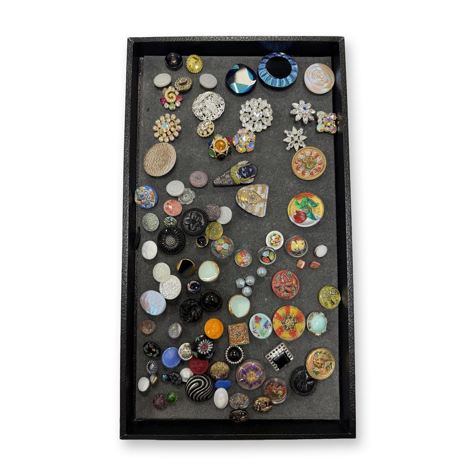 AN ASSORTMENT OF DIVISION THREE GLASS BUTTONS: 90 S/M/L assorted Czech Republic glass and paste jewel examples. This selection includes a large variety of styles including pictorials and patterns all dating to the late 1990's to early 2000's from 
