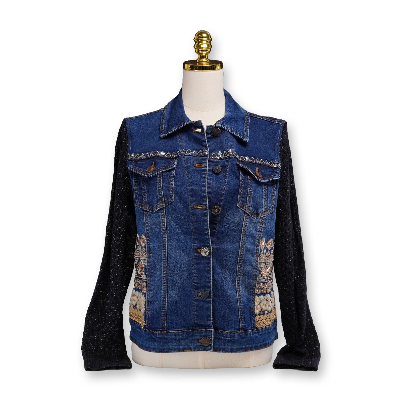 Contemporary Desigual Denim Jacket with Black Knit Sleeves and Embroidery Detailing: This contemporary mixed-media denim jacket by Desigual, dating to the early 21st century, features a medium-wash blue cotton denim body with intentional fading. The garment is constructed with contras