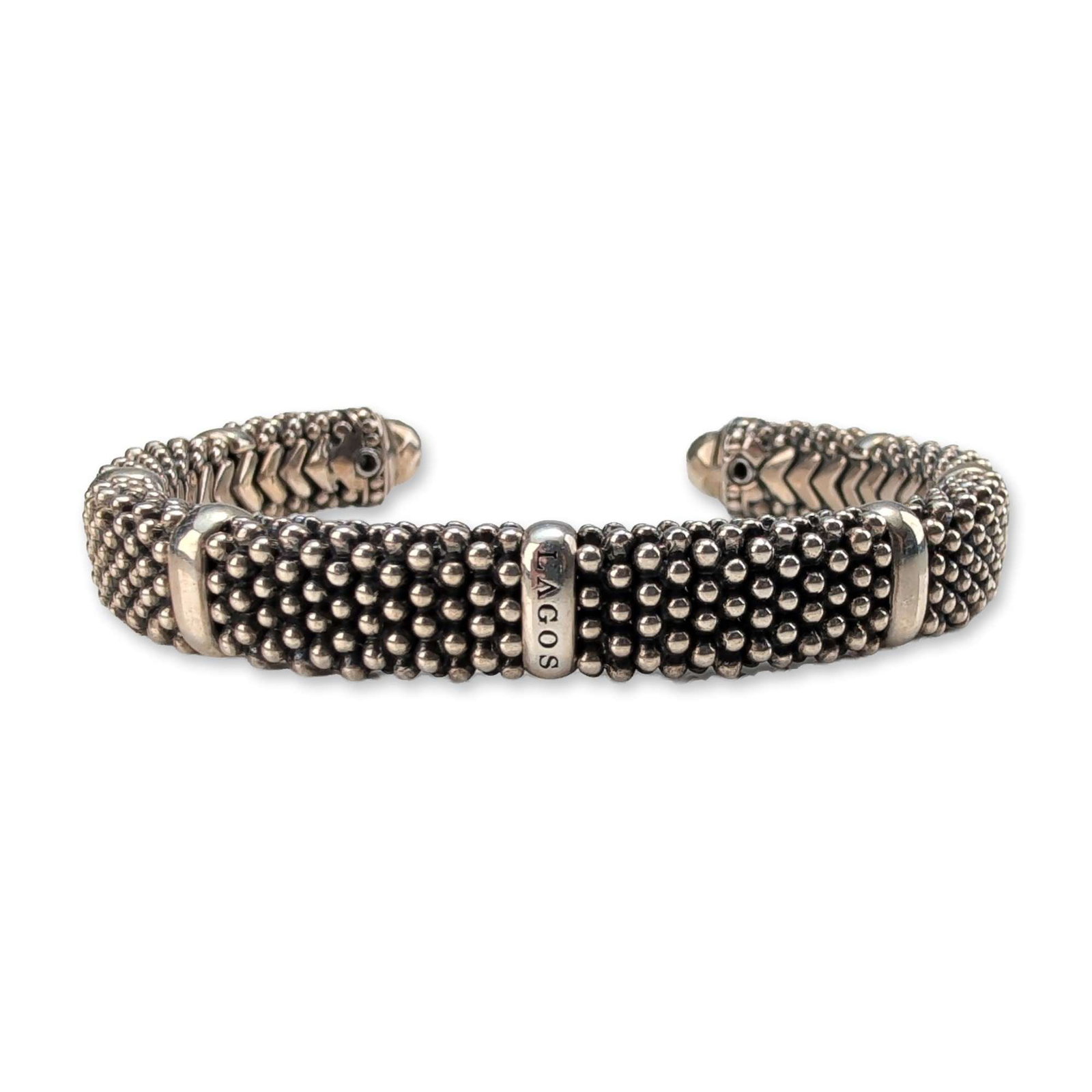 Lagos Sterling Silver Caviar Cuff Bracelet: Lagos sterling silver cuff bracelet from the Caviar collection. The exterior features the signature beaded texture characteristic of the collection, accented by two polished silver bands and polished 