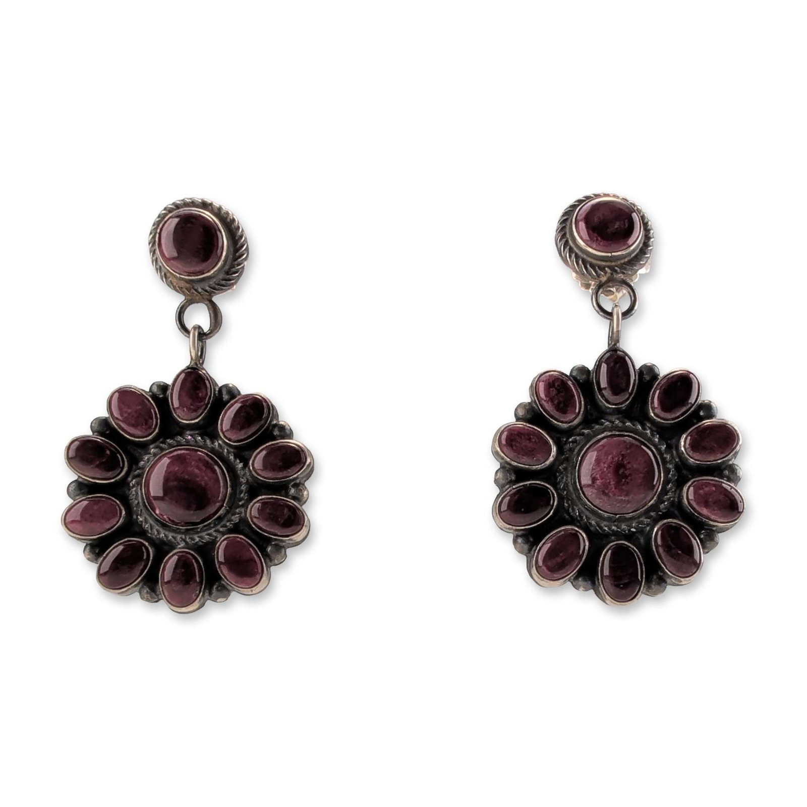 Navajo Sterling Silver and Purple Gemstone Cluster Earrings: Navajo style pair of cluster drop earrings in sterling silver, featuring vibrant purple gemstone cabochons in a sunburst arrangement. Each earring comprises a central round cabochon surrounded by twel
