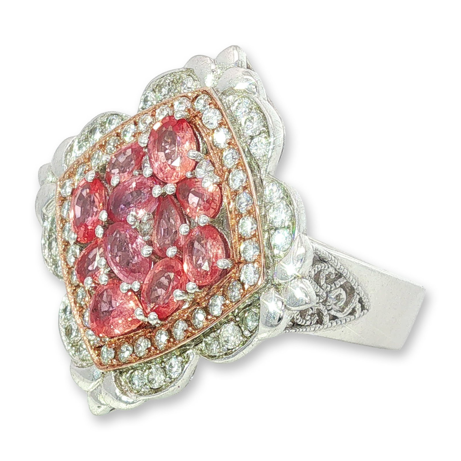 Sterling Silver Pink Stone Hinged Ring: Sterling silver cocktail ring in a floral quatrefoil design with rose gold-tone metal accents. The center features a cluster of eleven faceted pink stones in various cuts, including oval and pear shap