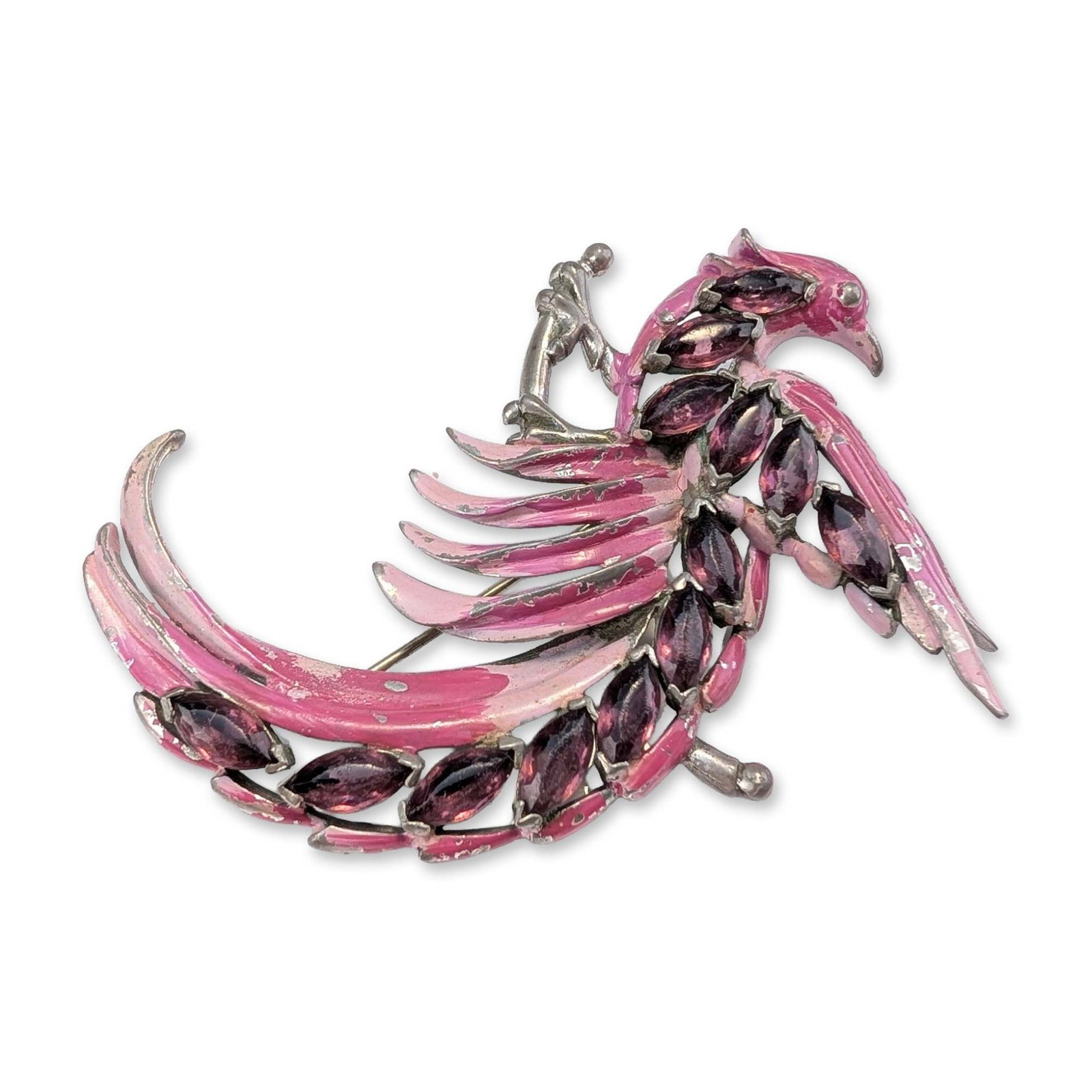 Chanel Novelty Company Pink Enamel Phoenix Bird Brooch: Chanel Novelty Company (American, New York, c. 1941). Stylized phoenix brooch in silver-tone base metal with pink cold-painted enamel and prong-set faceted purple marquise-cut glass stones. The figura
