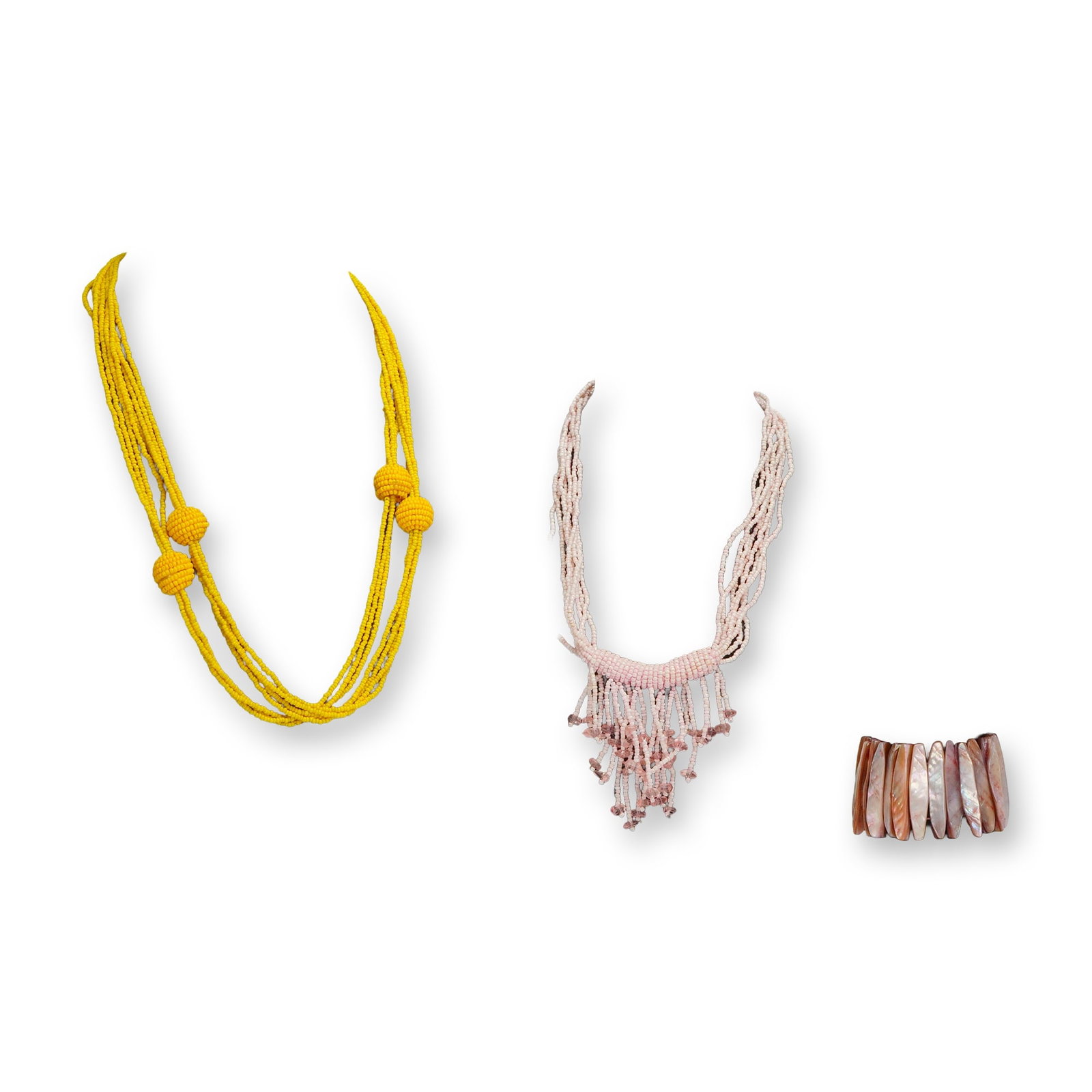 A Trio of Contemporary Beaded Necklaces and Shell Cuff Bracelet Set: The lot consists of a trio of contemporary costume jewelry pieces, including two beaded necklaces and one bracelet. The first necklace is a multi-strand design constructed from bright yellow seed bead