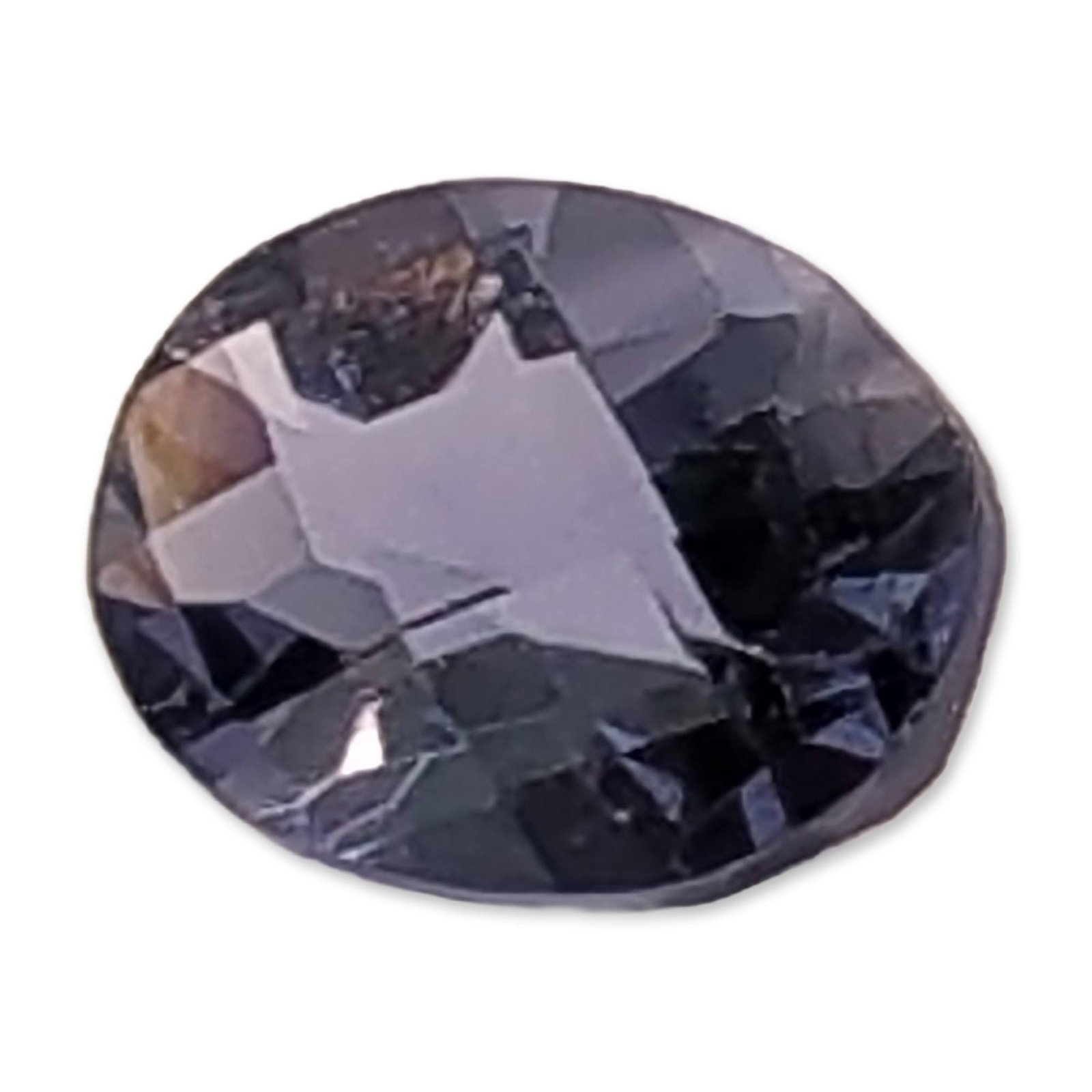Oval Cut Violet Gray Loose Iolite Gemstone: Loose faceted Iolite gemstone. The stone displays a dusky, smoky purple to violet-gray hue with shifting indigo tones. Cut in an oval mixed faceted style with a large table and deep pavilion.1.1ct