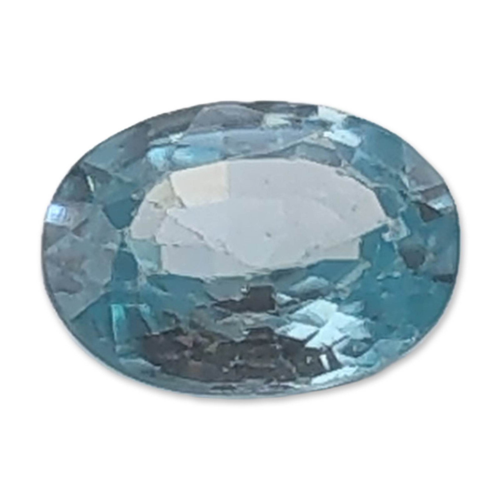 Light Blue Oval Faceted Topaz Gemstone: Loose faceted topaz gemstone, light blue in color, featuring an oval brilliant cut. The stone exhibits consistent light blue tones and sharp facet junctions. Weight: 1.2 caratsLength: 6.8 mm.