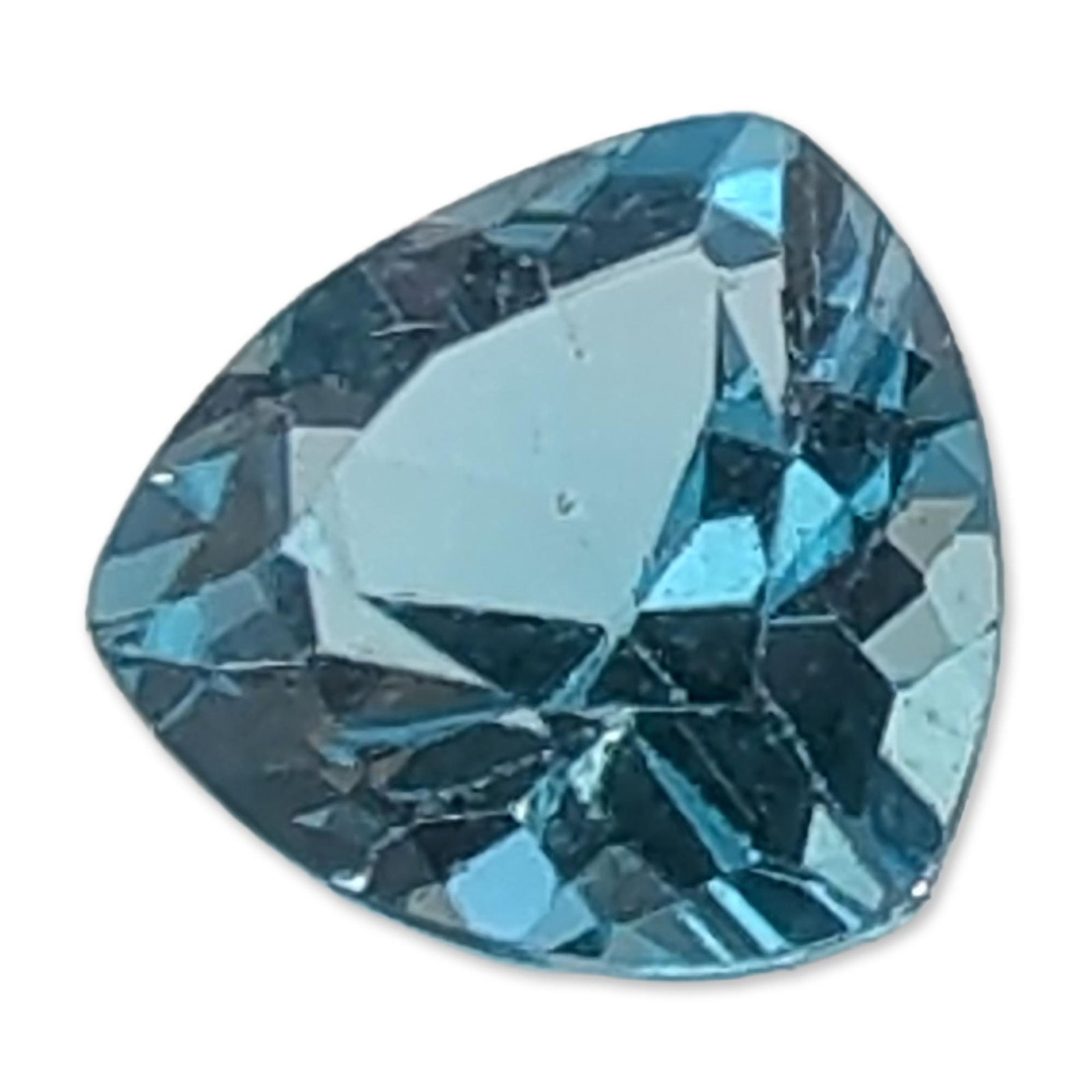 Trillion Cut Light Blue Loose Topaz Gemstone: Loose trillion cut light blue gemstone, in the style of Swiss blue topaz. The stone displays a uniform sky blue color and high clarity. Features sharp facet junctions and a triangular form with