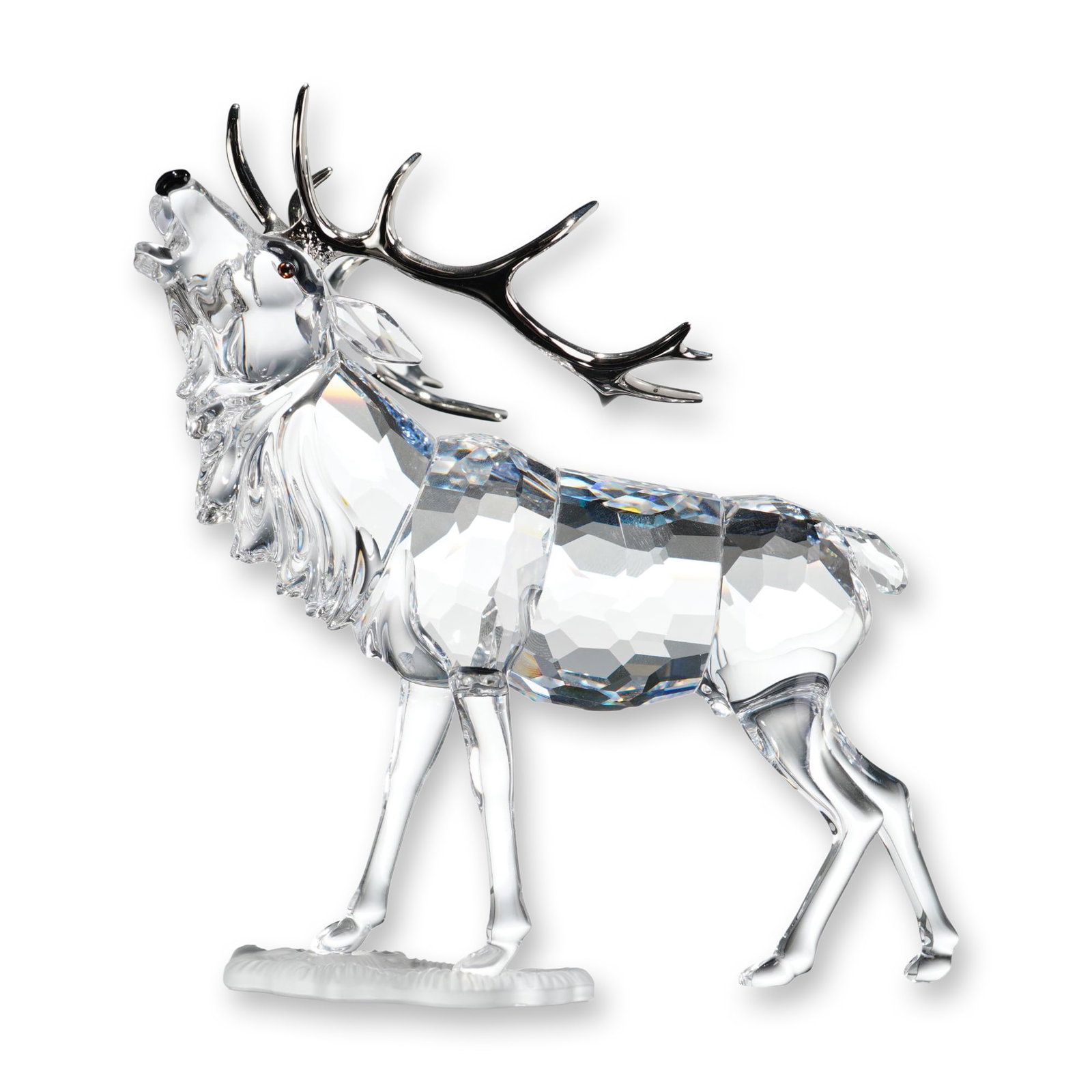 Swarovski Crystal Figurine, Stag: Swarovski crystal figurine titled Stag, designed by Adi Stocker as part of the Rare Encounters collection. The faceted lead crystal figure depicts a stag in a bugling pose with its head tilted back, f