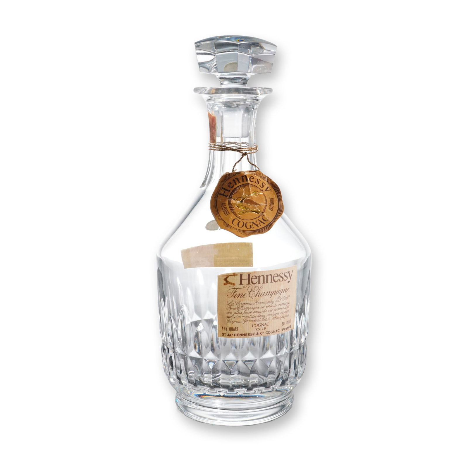 Hennessy Cognac Baccarat Crystal Centerbury Decanter: This crystal decanter in the Canterbury pattern was produced by Baccarat in France for Hennessy Cognac and retains its original multifaceted geometric stopper. The lead crystal vessel features a pear-