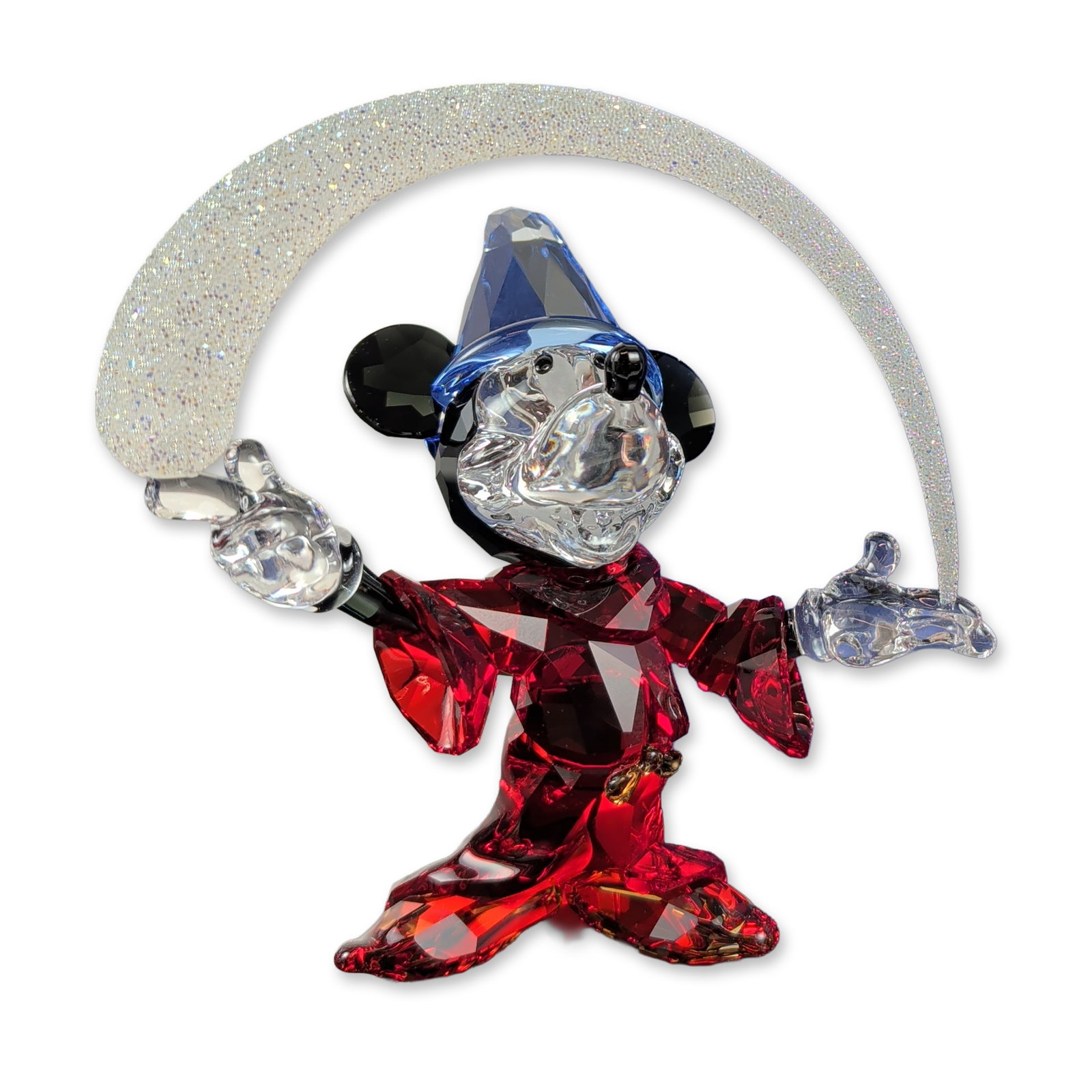 Swarovski Disney Crystal Figurine, Sorcerer Mickey: Swarovski Disney collection crystal figurine depicting Mickey Mouse as the Sorcerer's Apprentice from the film Fantasia. The figure is constructed of multifaceted crystal featuring a red robe, a blue 
