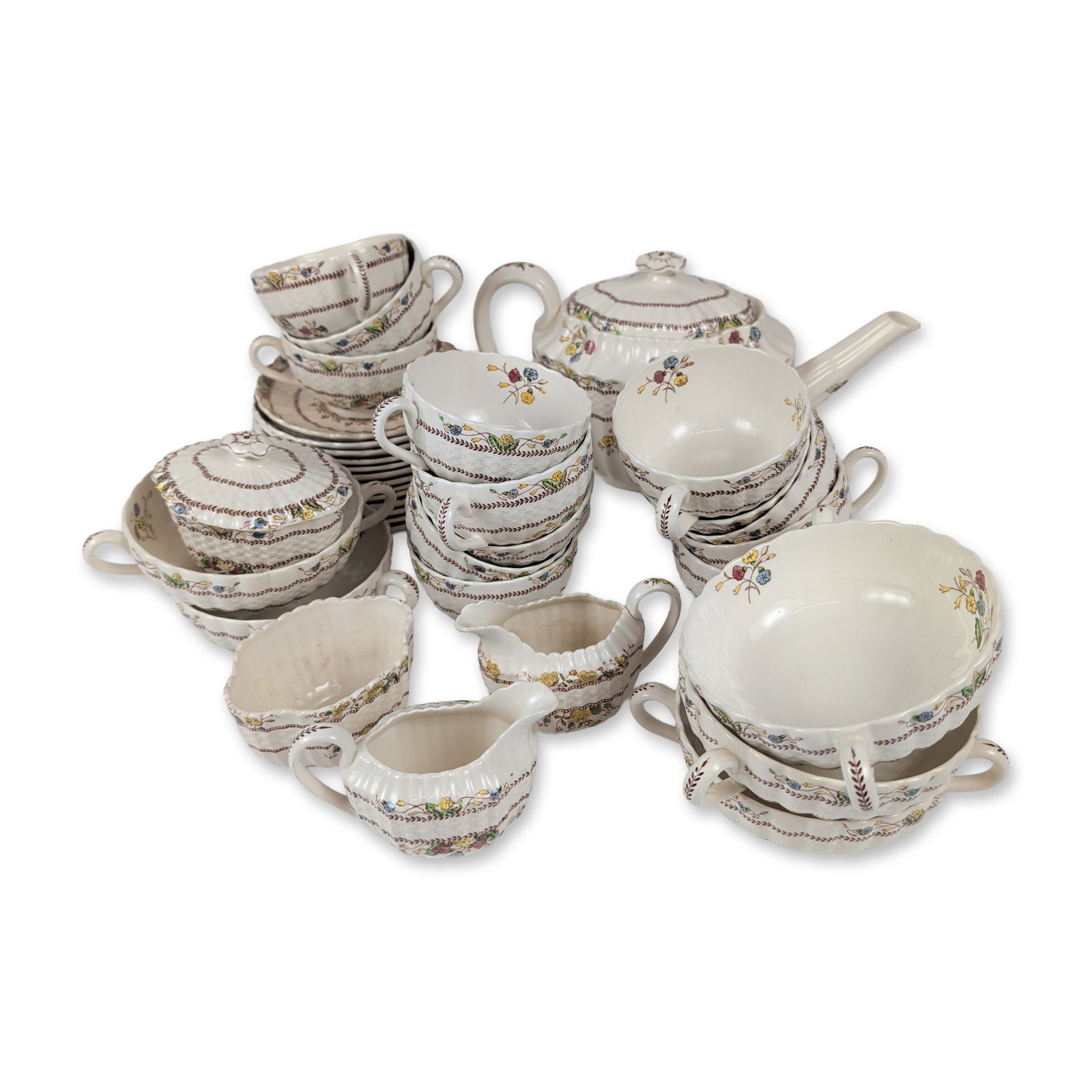 34pc Copeland Spode Mixed Earthenware Tea Service, Cowslip: The set features vibrant polychrome transfer-printed floral sprays in yellow, blue, and purple, framed by rich brown foliate borders. It includes 13 cups and 13 saucers, 1 lidded teapot, 2 creamers, 5