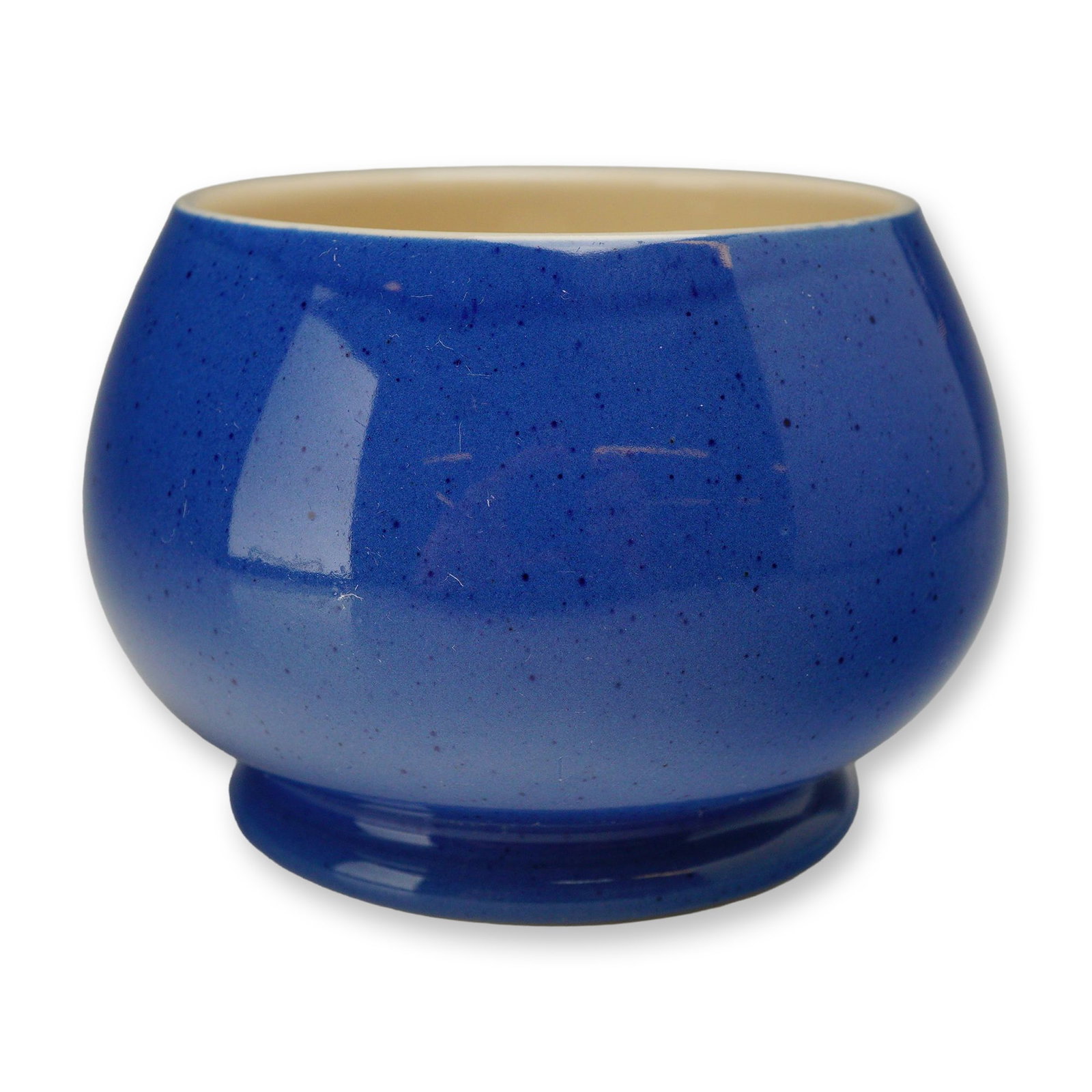Moorcroft Powder Blue Speckled Sugar Bowl: Moorcroft pottery open sugar bowl in the Powder Blue pattern. This earthenware vessel features a bulbous, globular form and a short, flared pedestal foot. The exterior is finished in a glossy blue